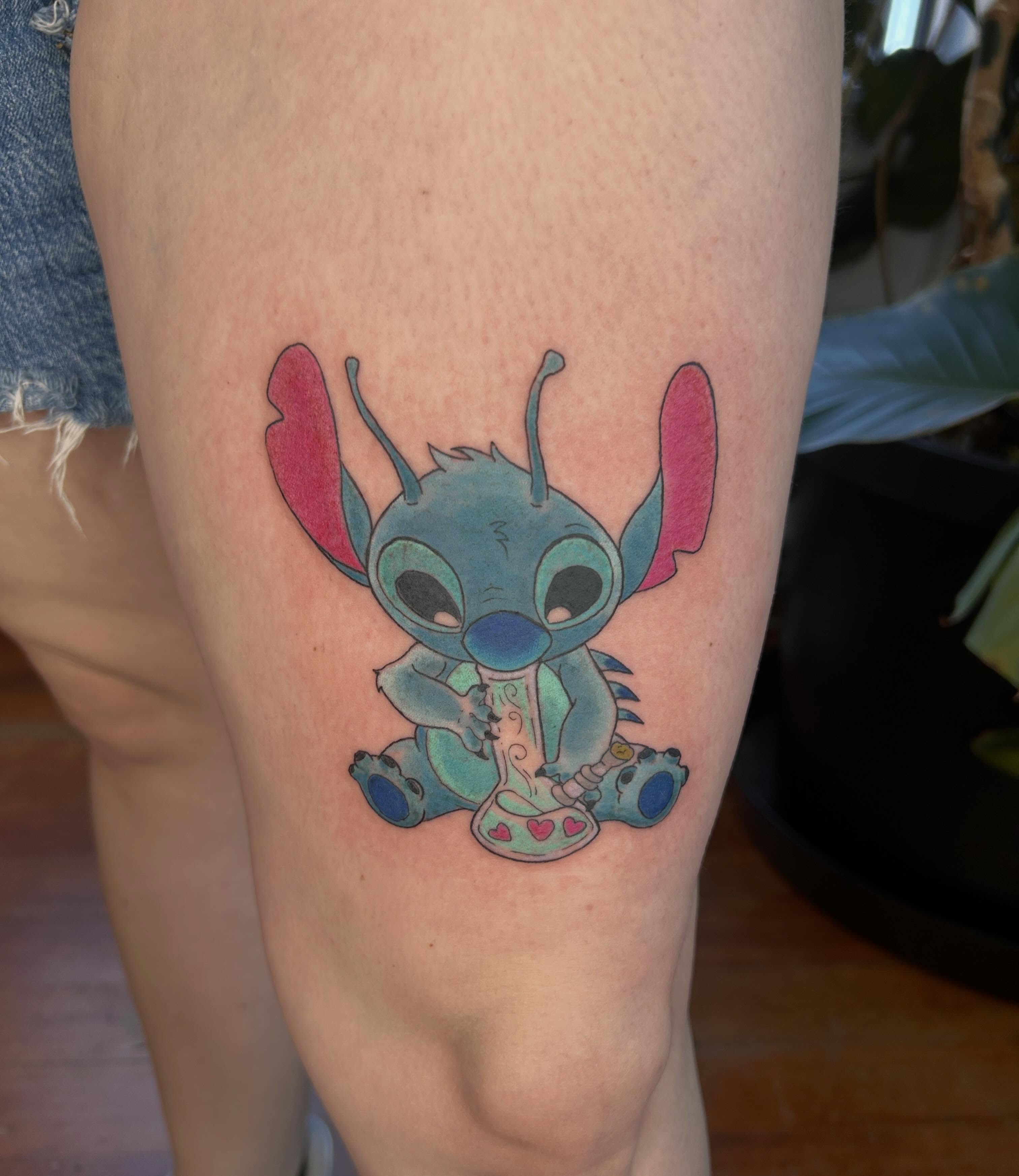 Stitch new school tattoo on the thigh by Reilley Earles