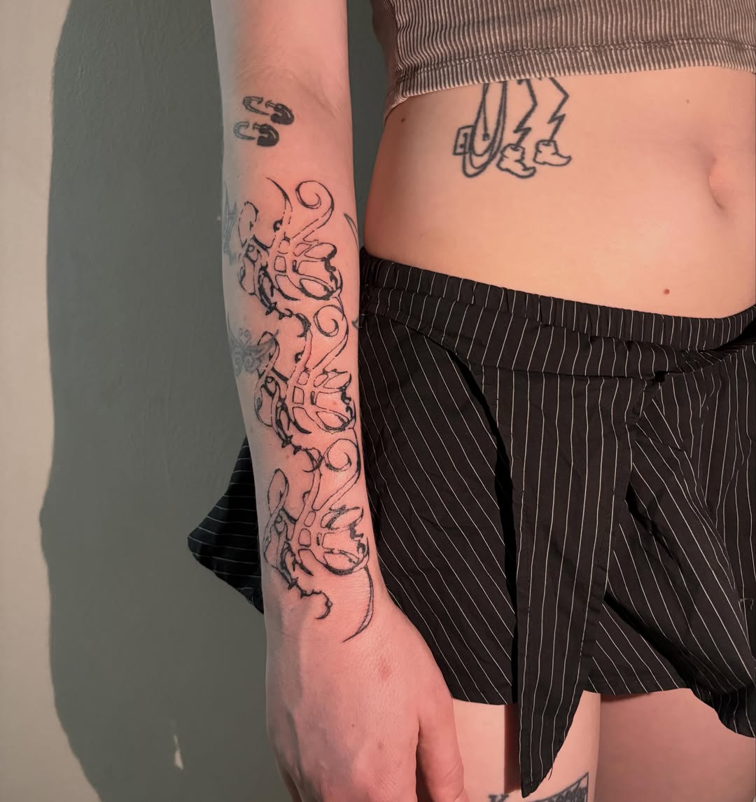 Octopus black and grey tattoo on the forearm by madeline