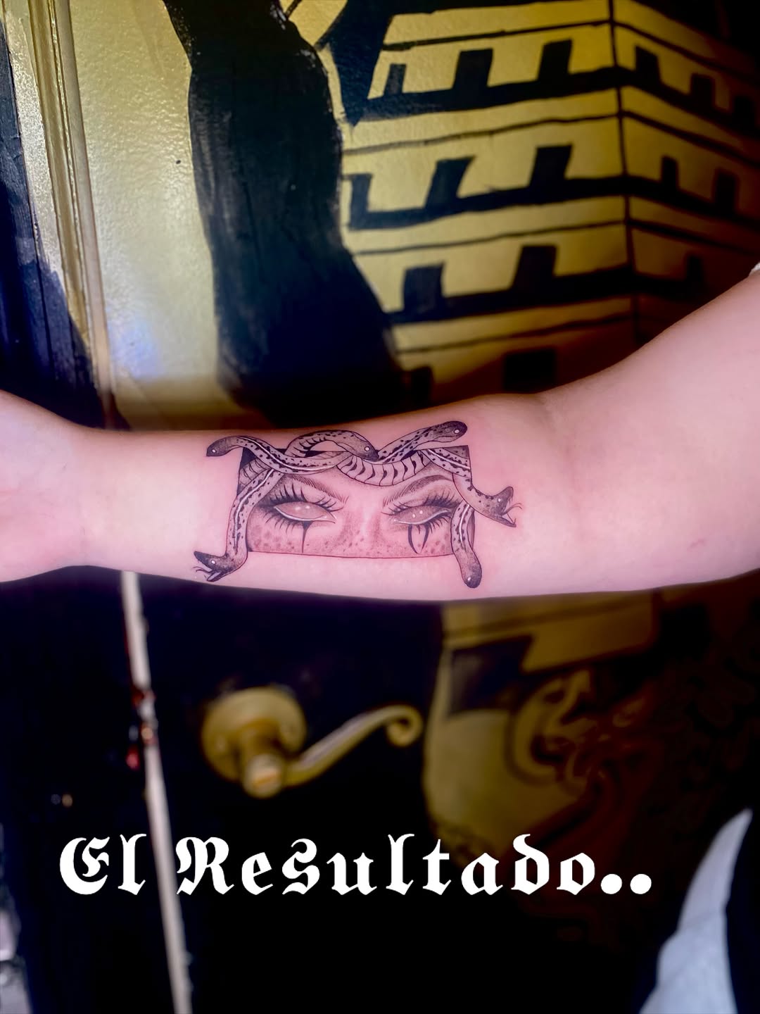 Medusa eyes and snakes realism tattoo on the forearm by Irving Guzman