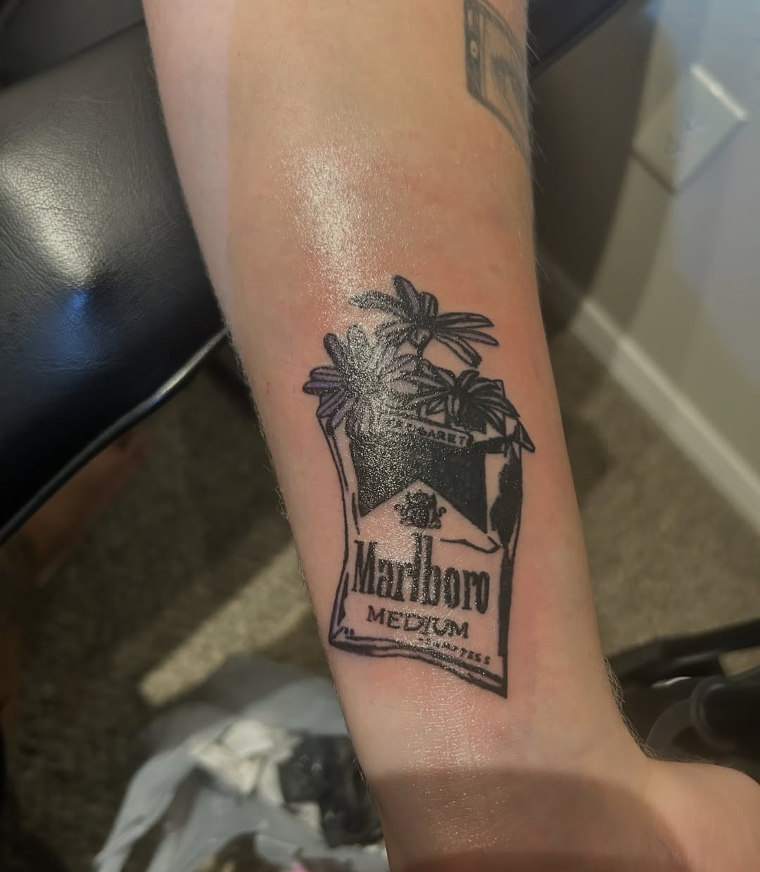 Marlboro cigarette pack black and grey tattoo on the forearm by @tatzbythadon
