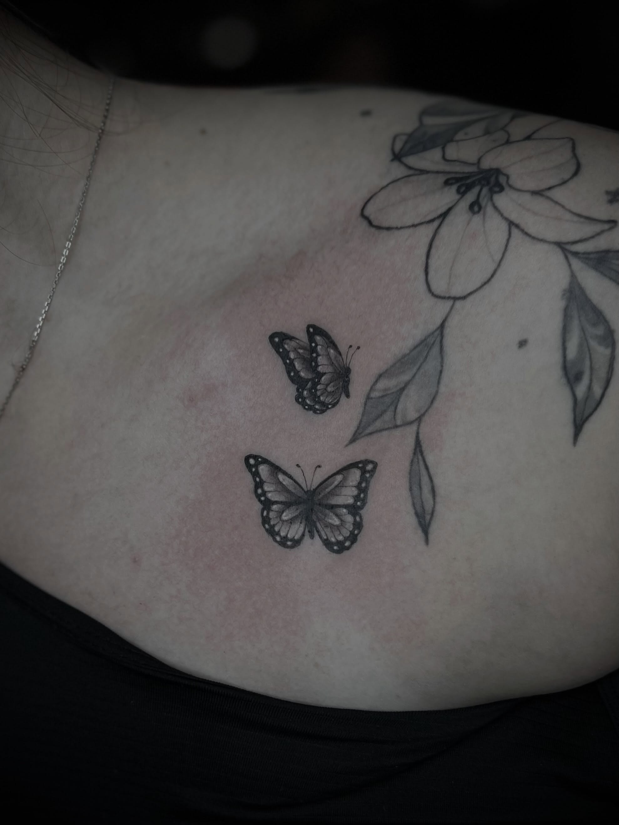 Butterflies and flower black and grey tattoo by Lexi Rose