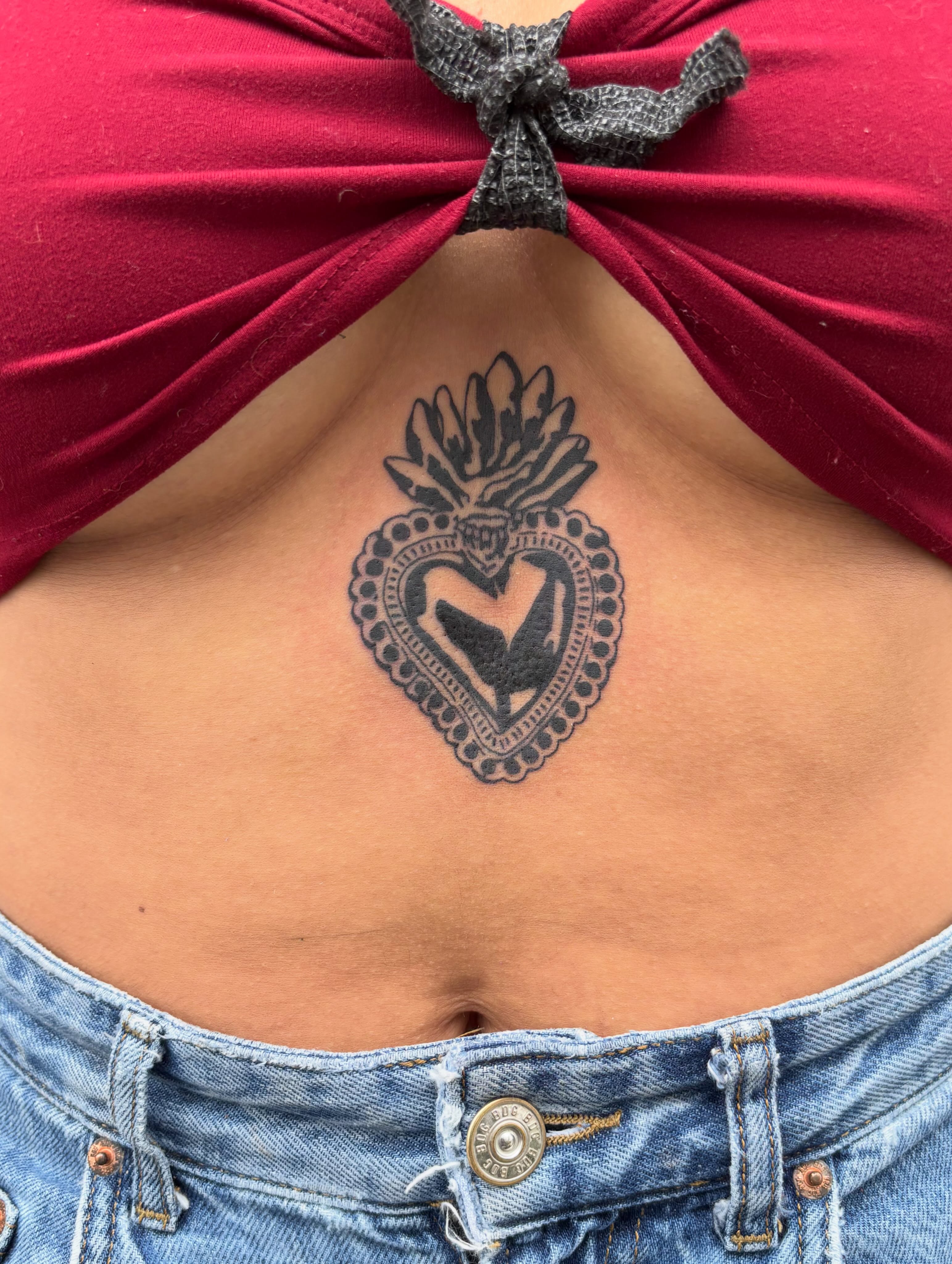 Heart with crown black and grey tattoo on the chest by Turner