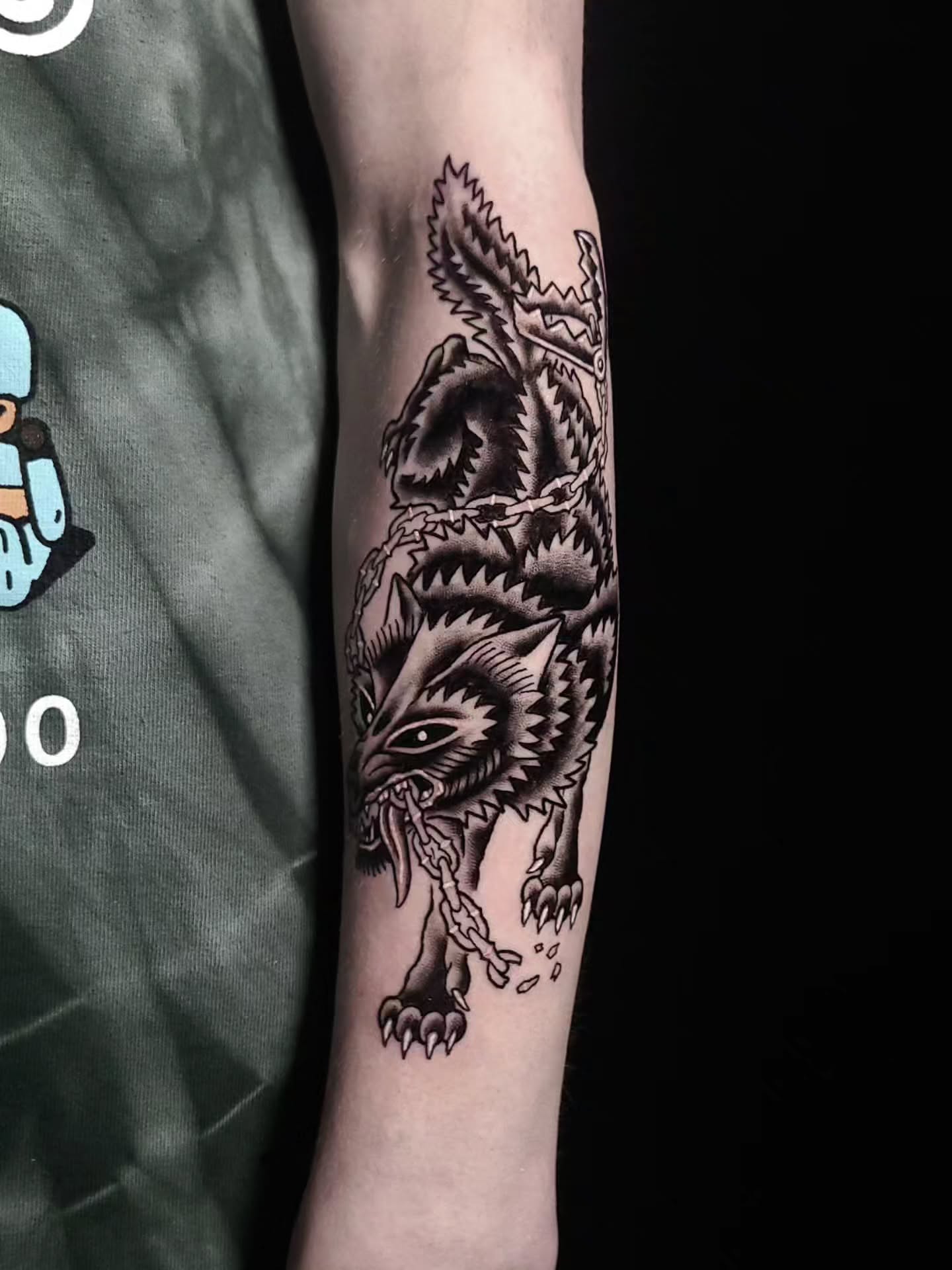 Wolf black and grey tattoo on the forearm by Alex Stairs