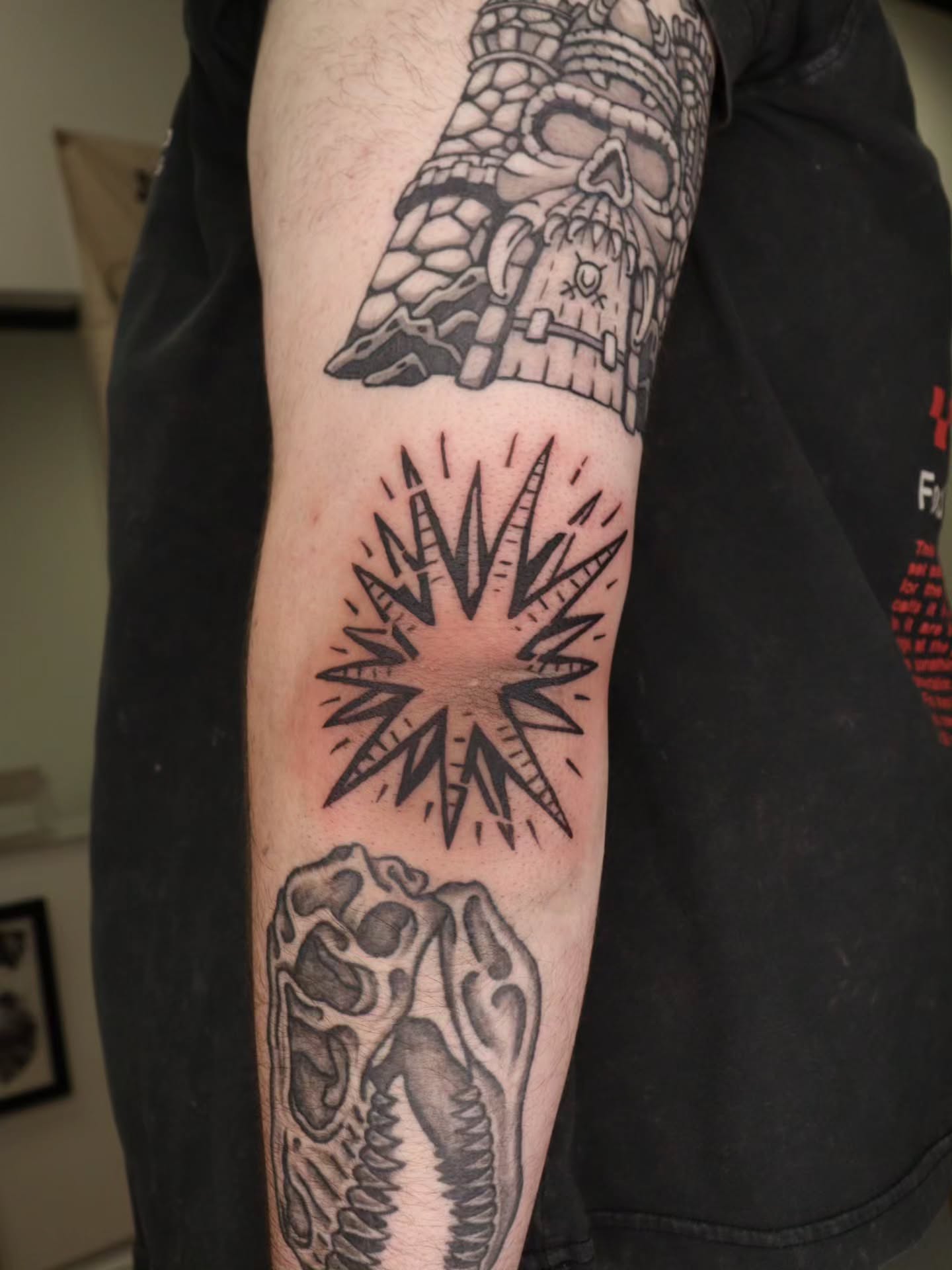 Geometric starburst geometric tattoo on the forearm by Veronika Lipchak