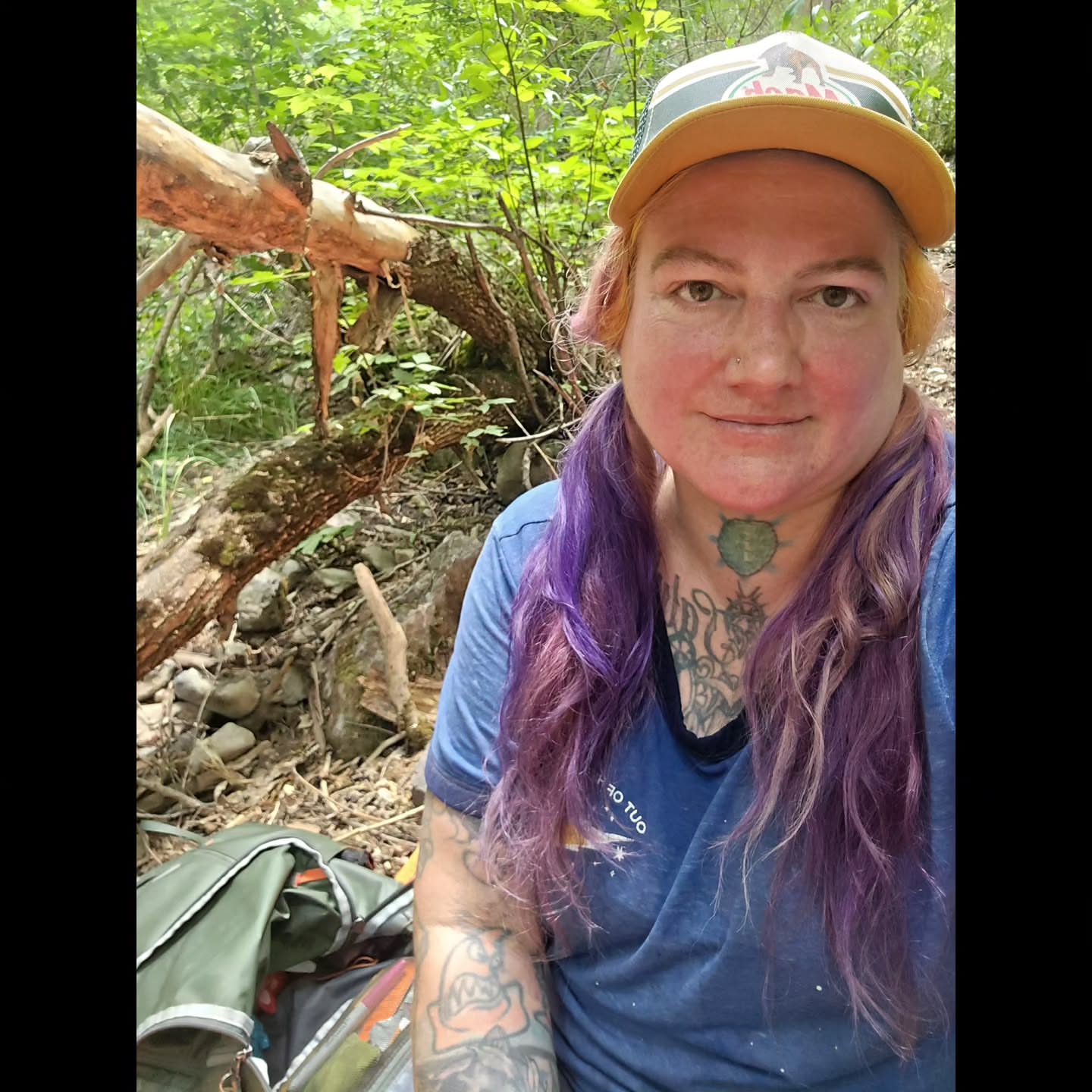 Purple hair American traditional tattoo on the head by bonnie