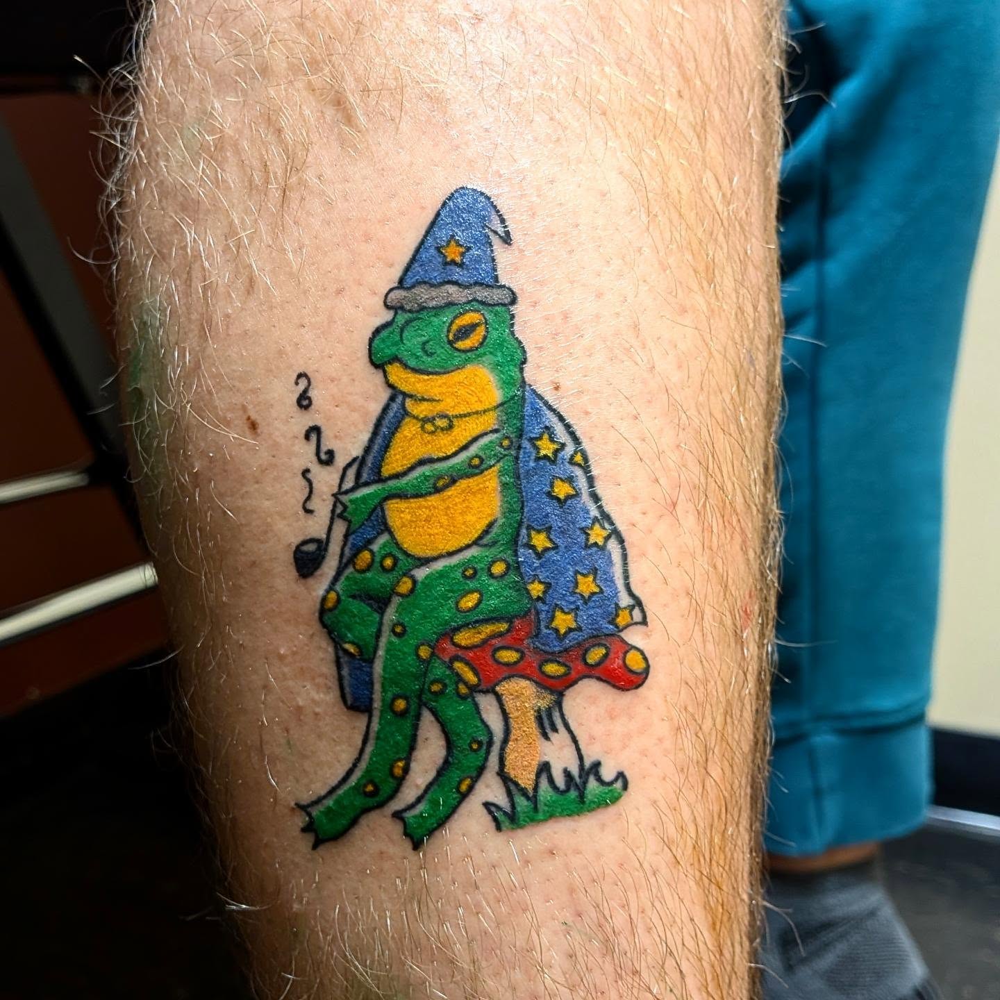 Wizard frog trash polka tattoo on the forearm by Kam