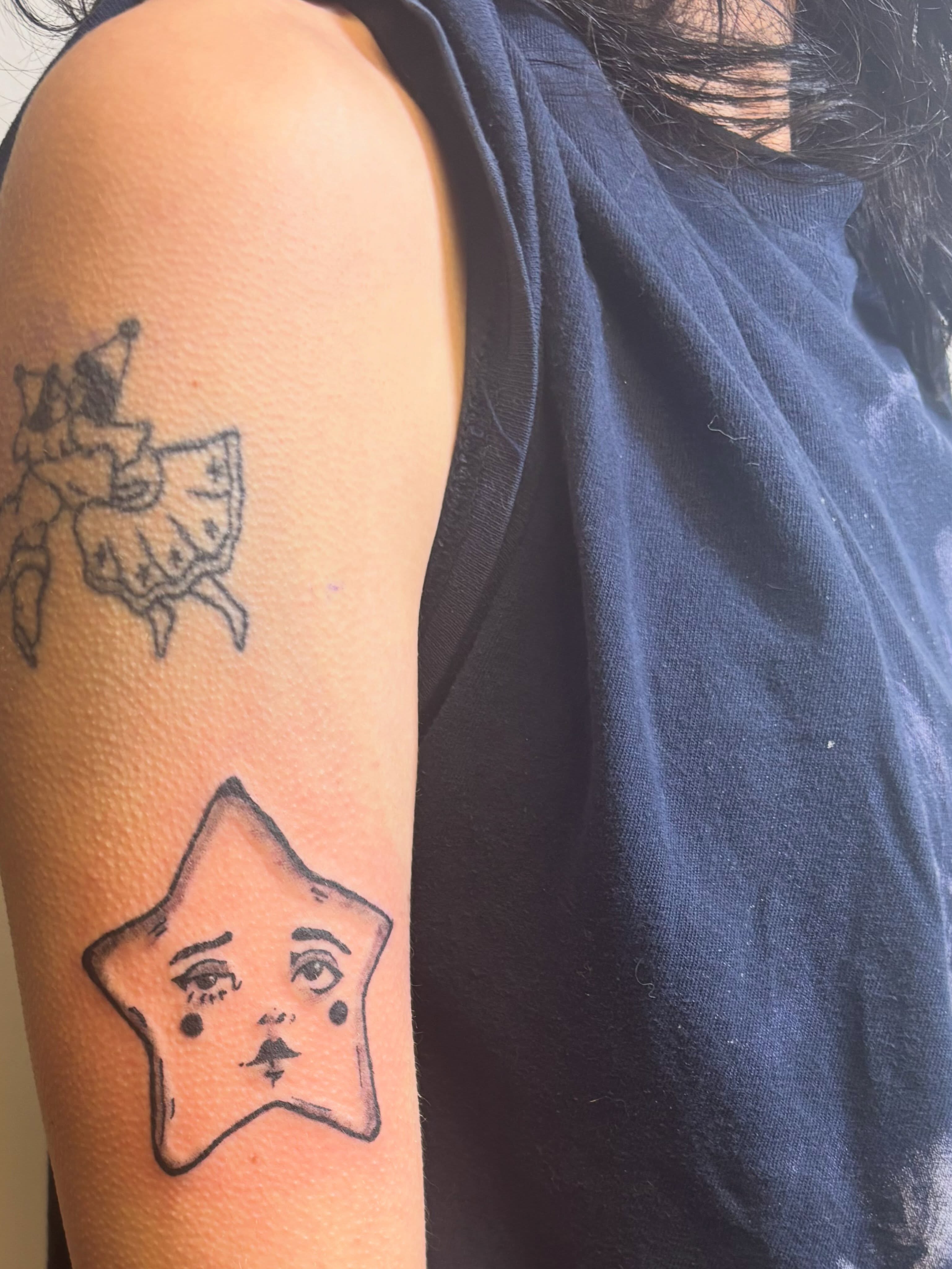 Star with face geometric tattoo on the forearm by Natalie Jade Shupe