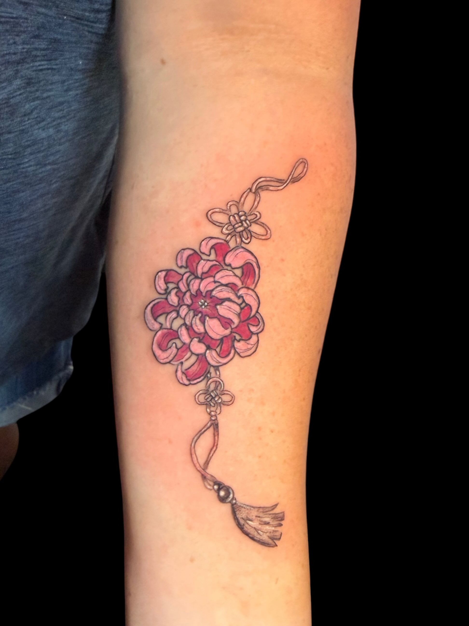 Chrysanthemum dotwork tattoo on the forearm by Gabrielle Frelak, York, Pennsylvania