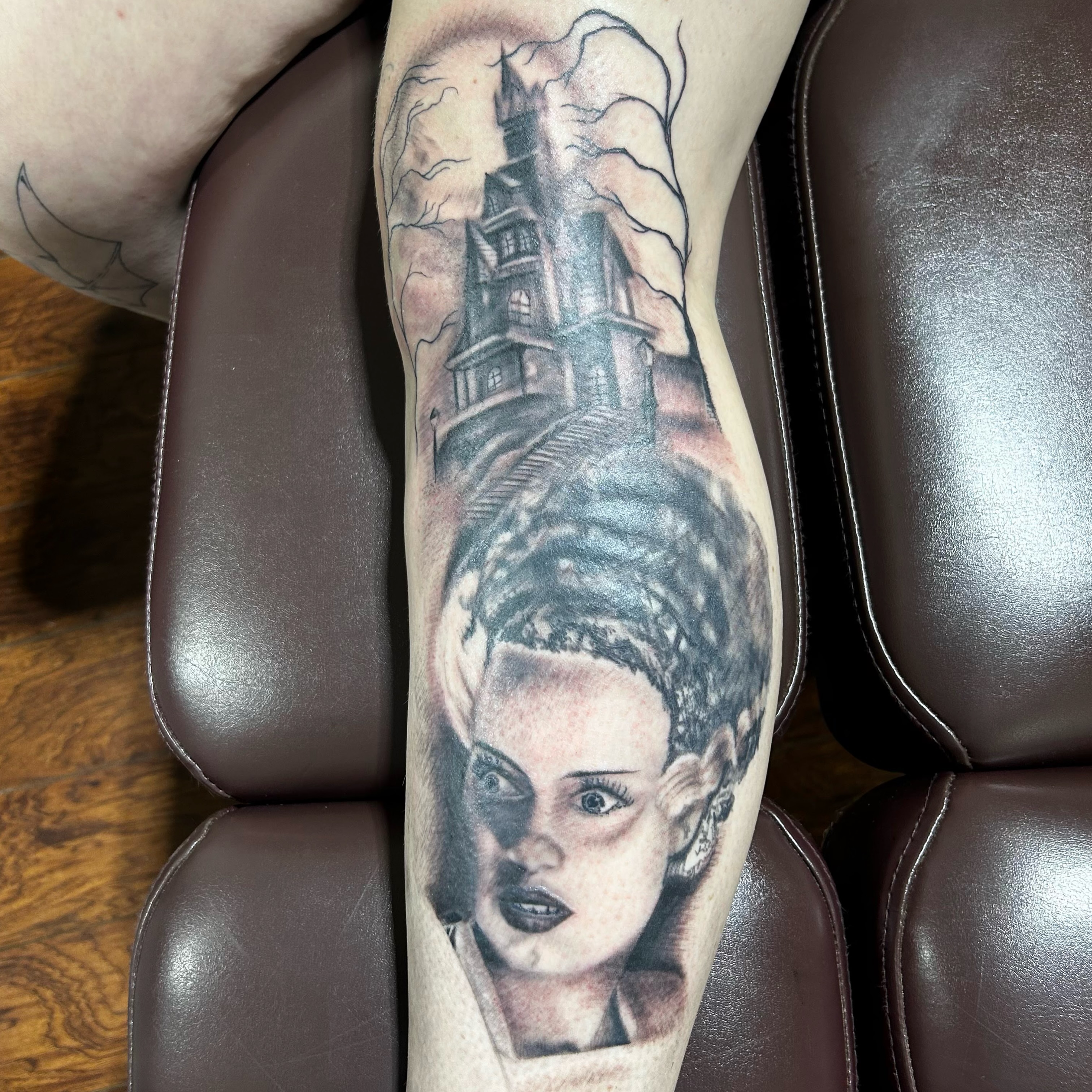 Haunted house and woman realism tattoo on the forearm by Andy Rowe- Tattoo Artist🦇