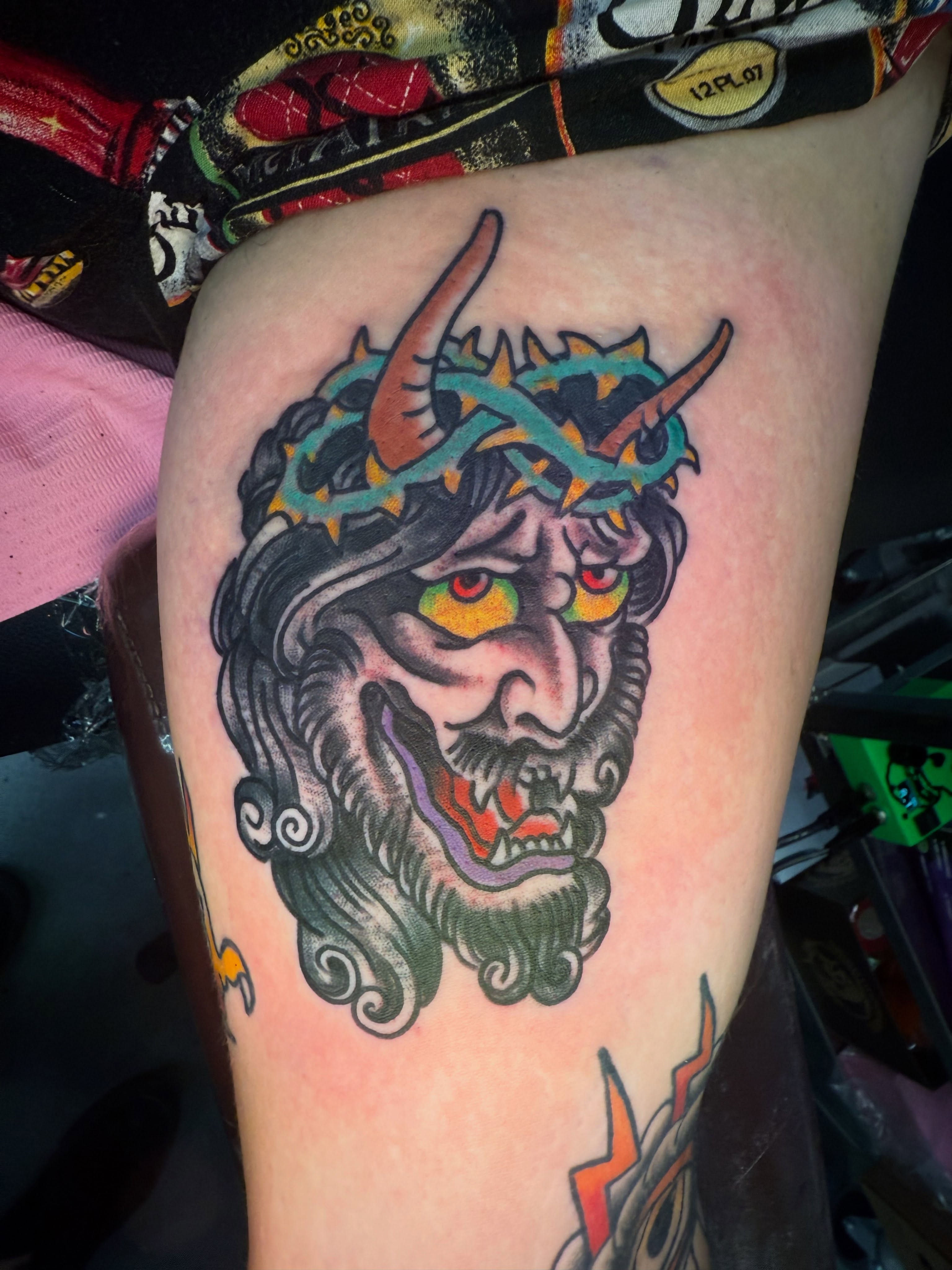 Demon head American traditional tattoo on the thigh by Arron Albaugh