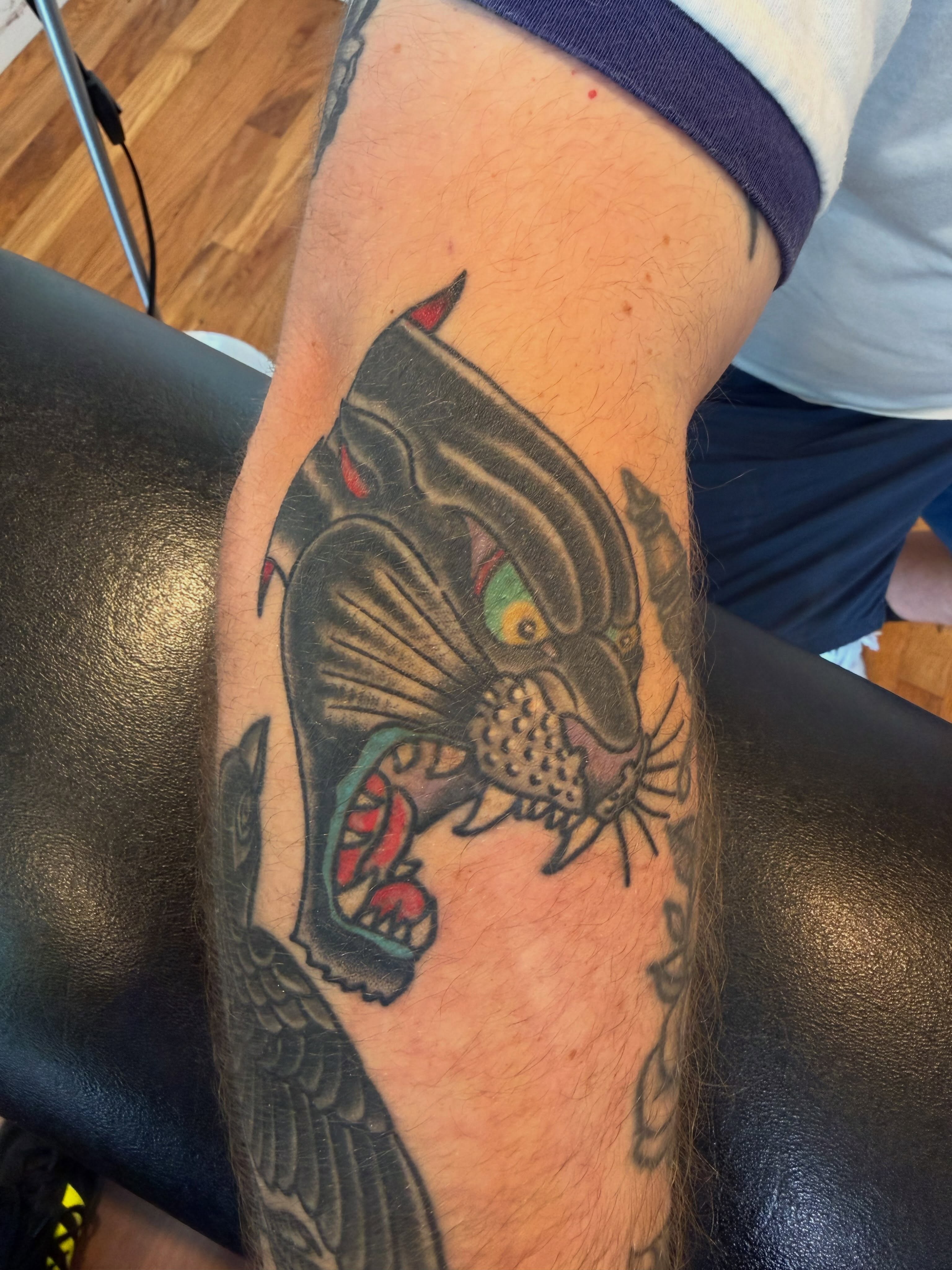 Panther American traditional tattoo on the forearm by Mike Kepper