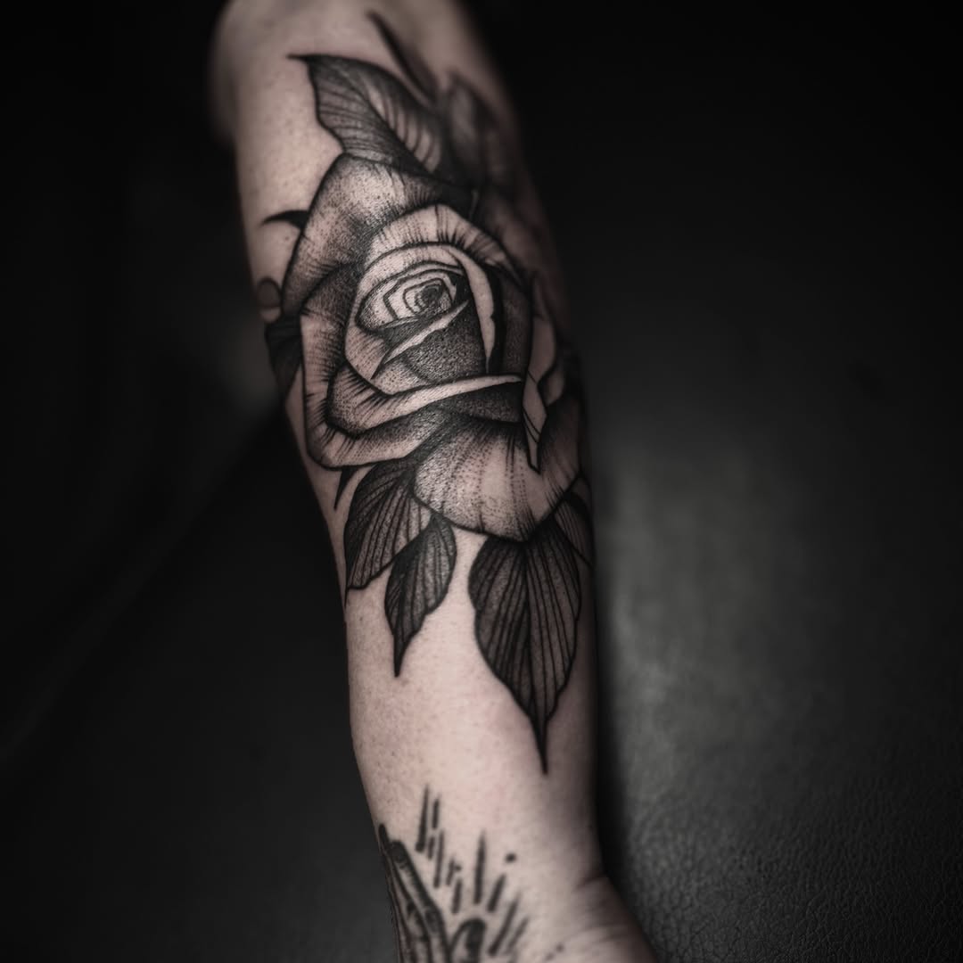 Rose black and grey tattoo on the forearm by t a y l o r