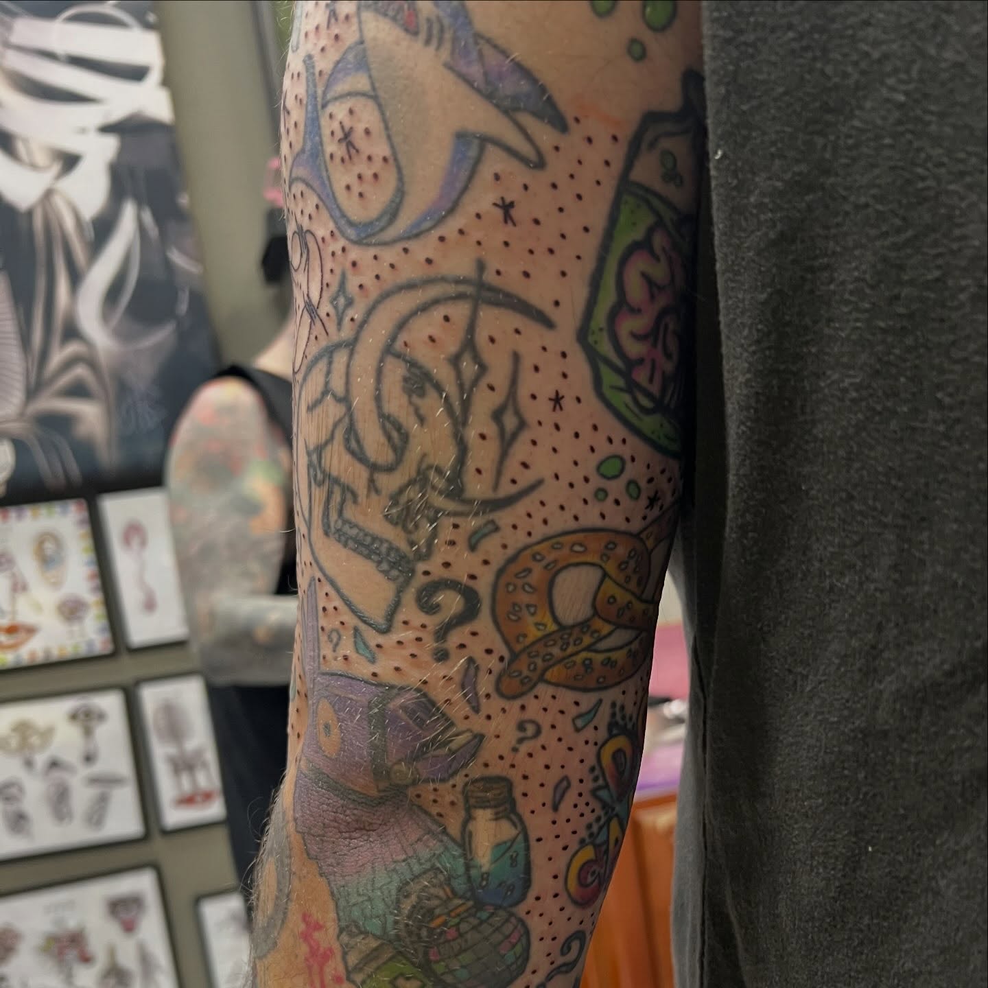 Skull and crescent moon dotwork tattoo on the forearm by Tomfoolery