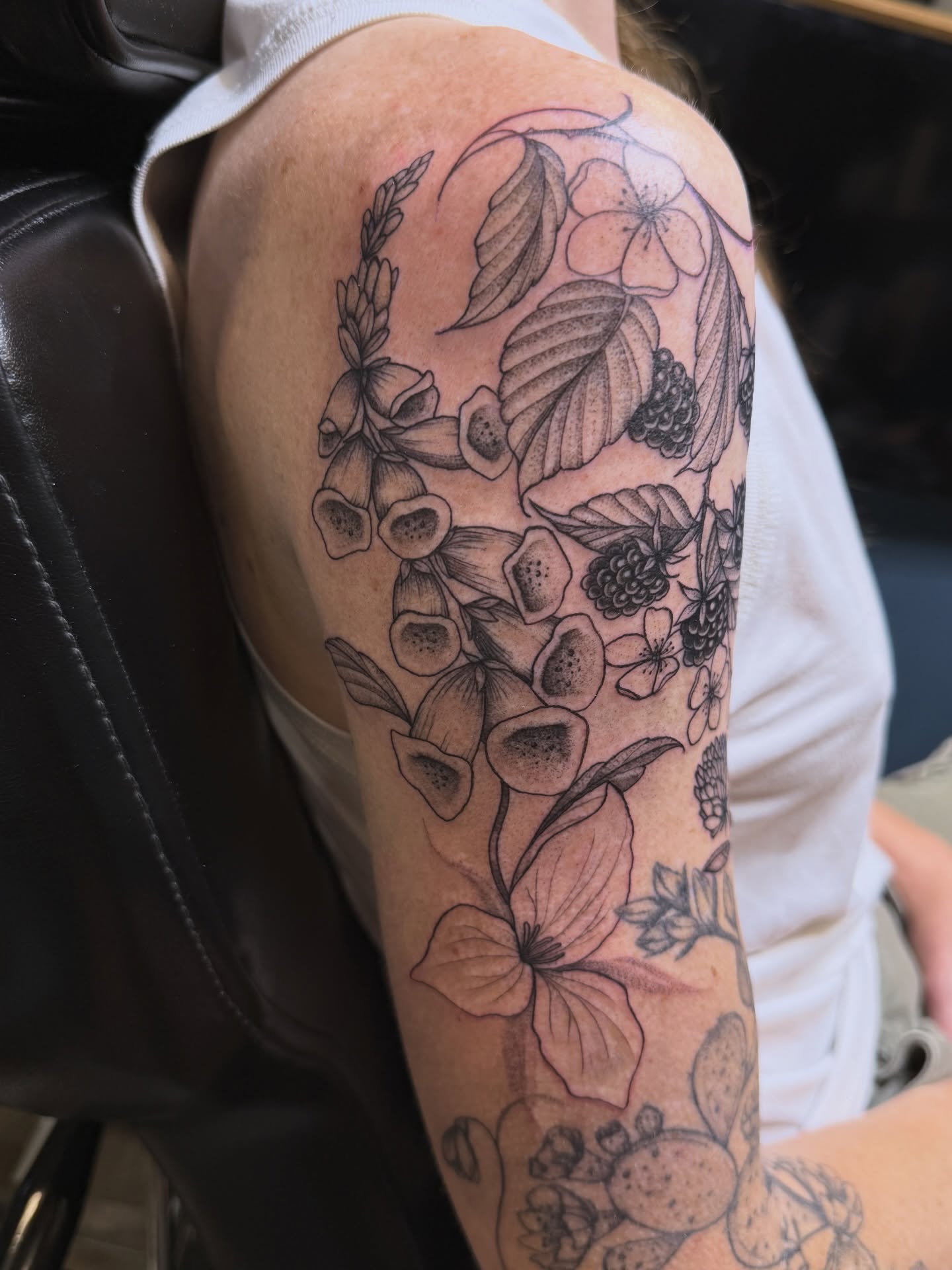 Floral arrangement black and grey tattoo on the forearm by WhoisLaineyTattoos