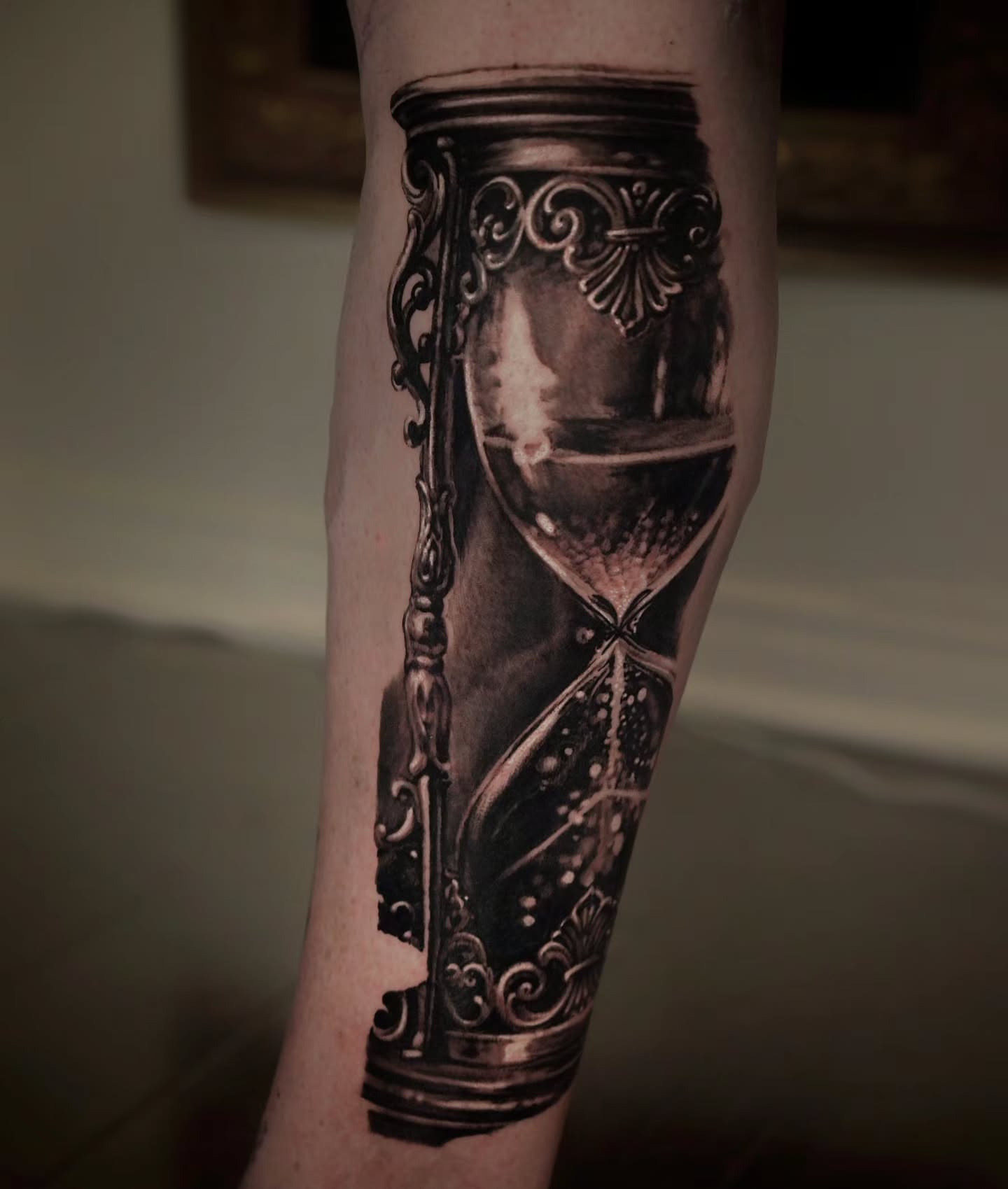 Hourglass realism tattoo on the forearm by Owen Paulls
