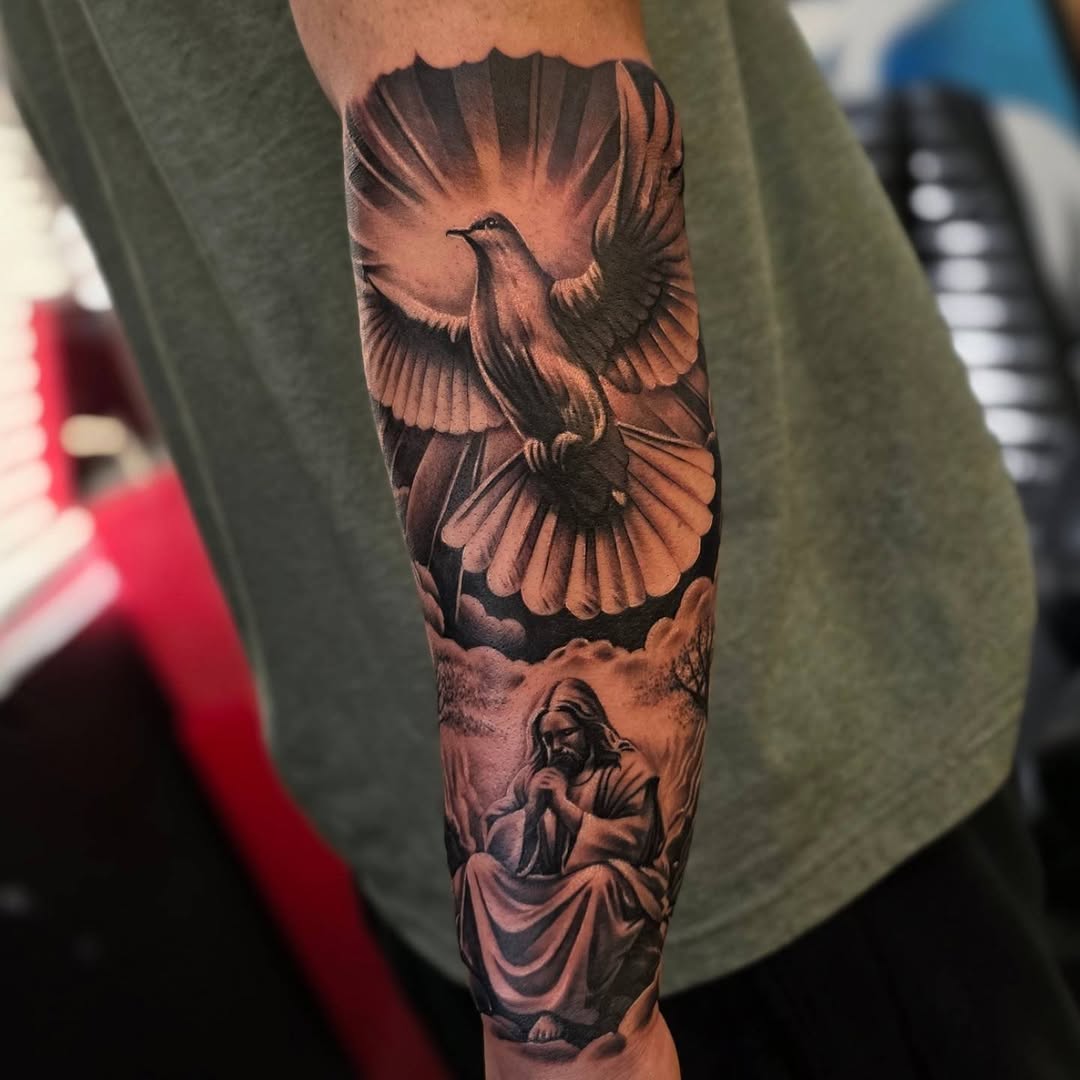 Dove and Jesus praying realism tattoo on the forearm by Mario Beltran