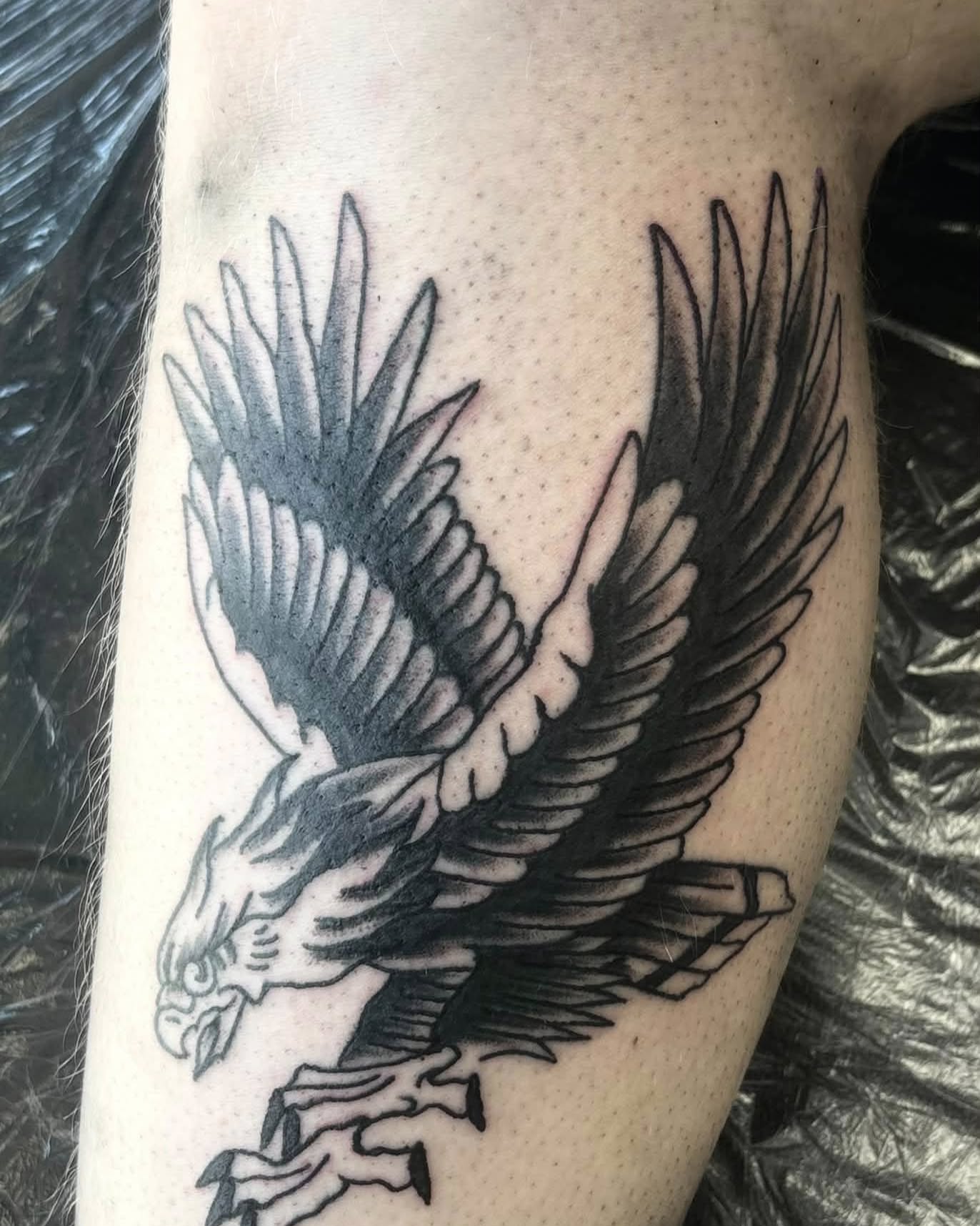 Eagle black and grey tattoo on the forearm by Landon Bagley