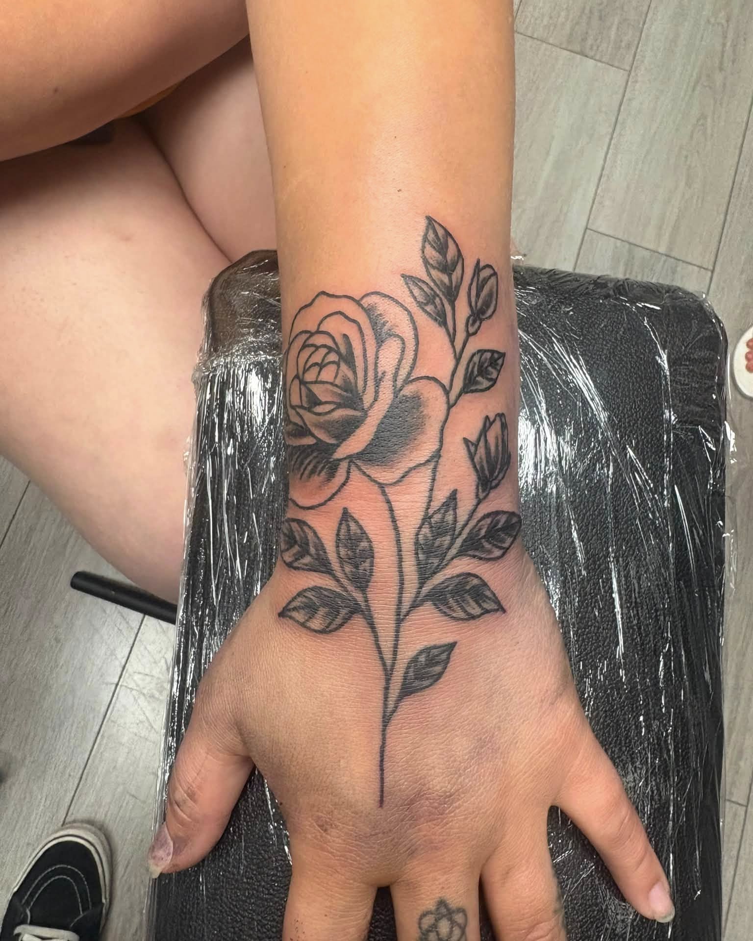 Rose black and grey tattoo on the hand by Landon Bagley