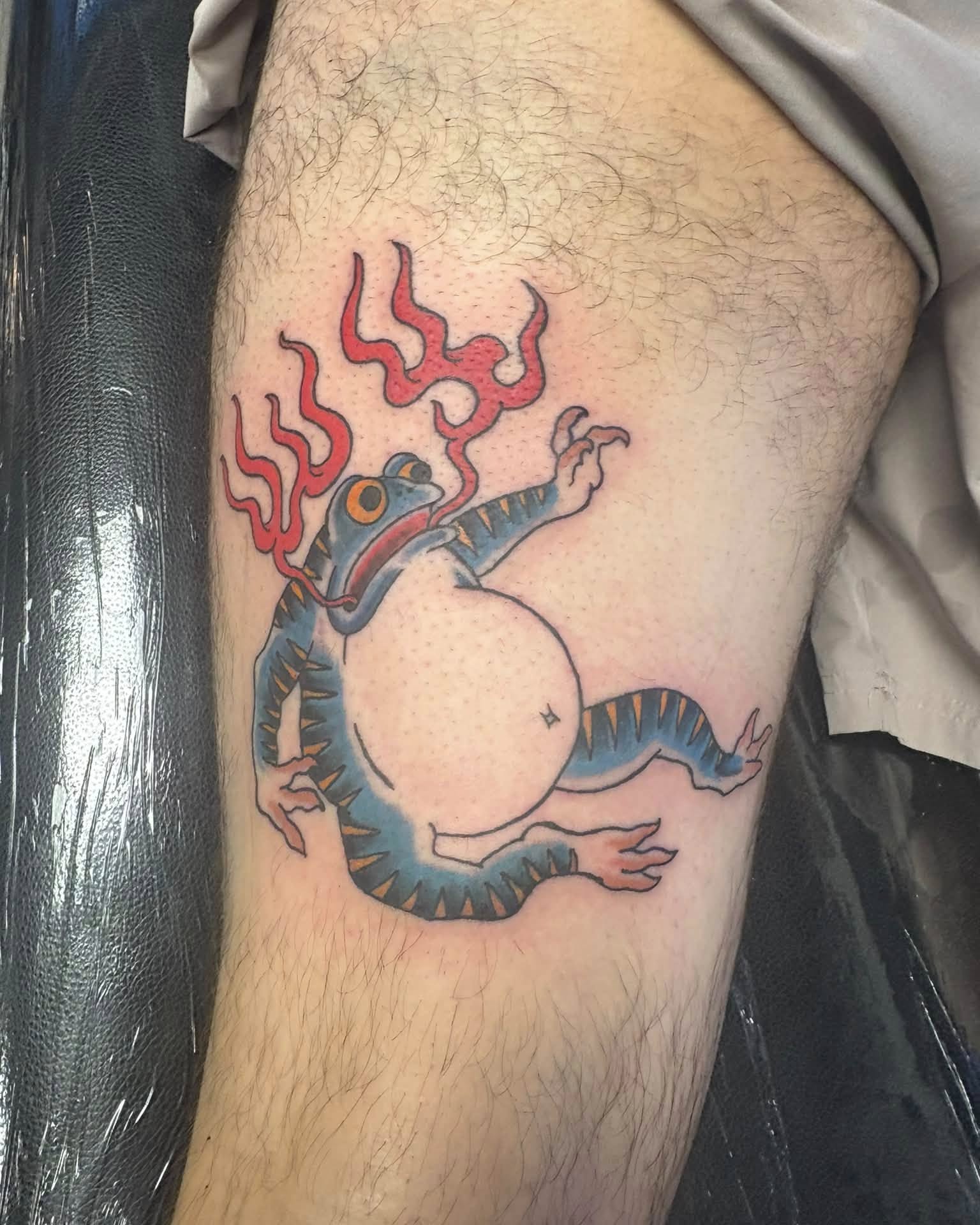 Frog American traditional tattoo on the thigh by Landon Bagley