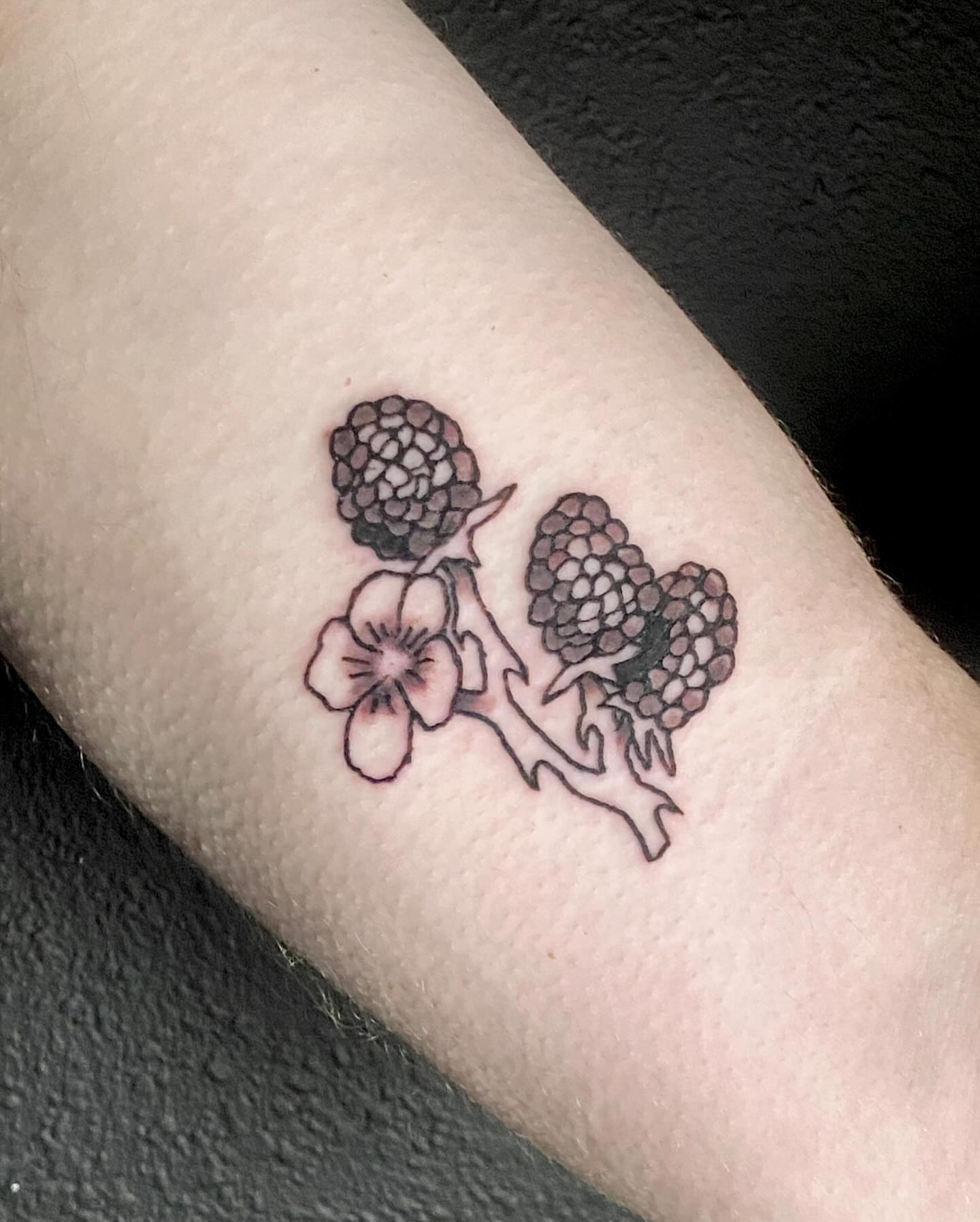 Flower and berries black and grey tattoo on the forearm by ollie, Portland, Oregon