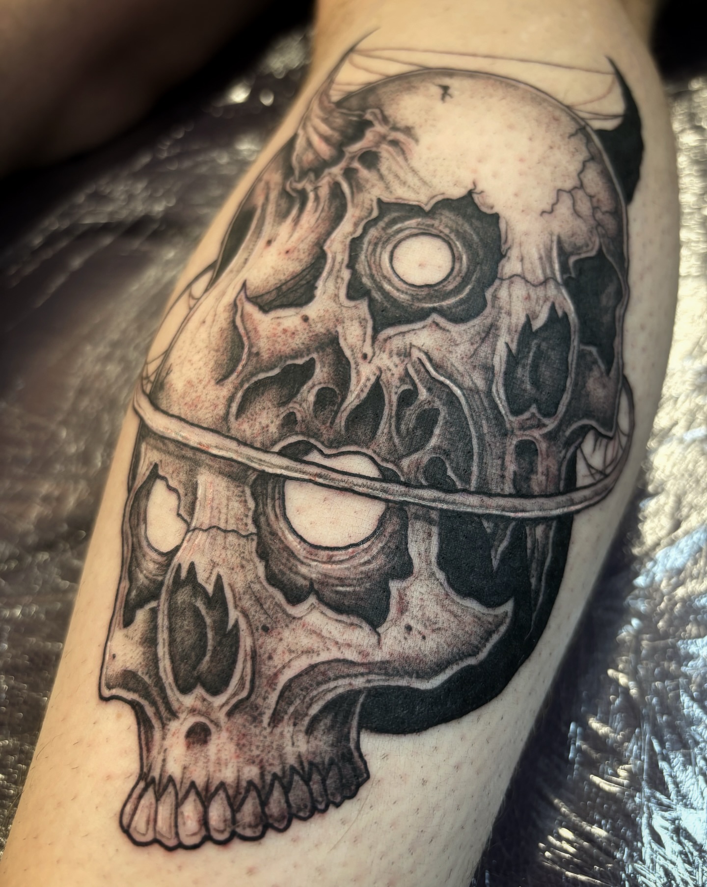 Tattoo by @scorchedbones_ — black_and_grey, realism