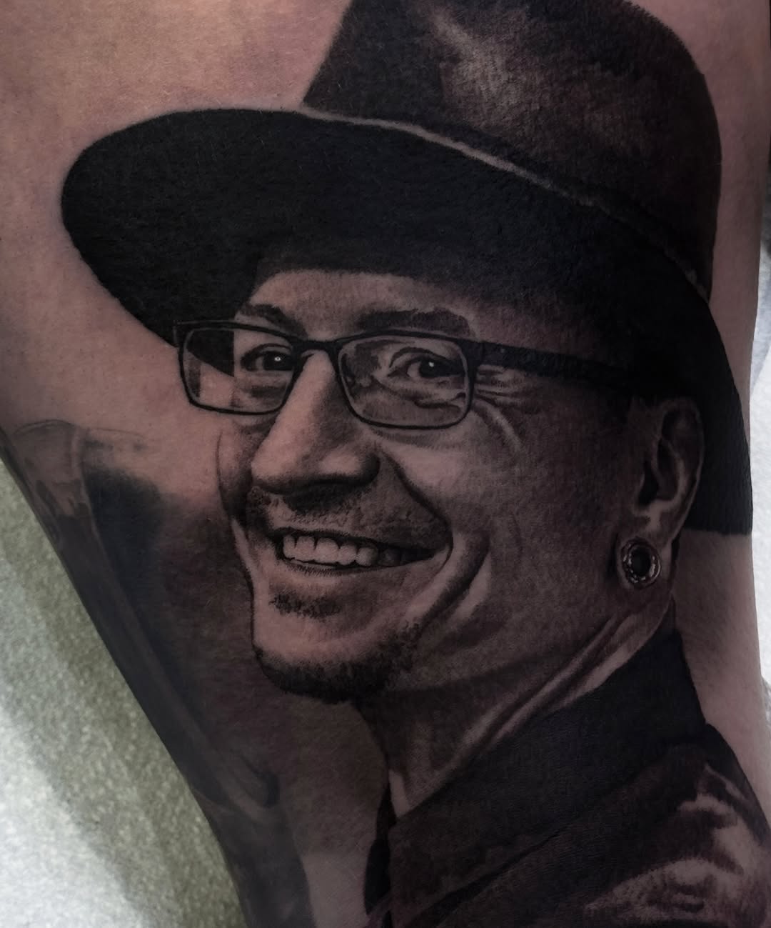 Tattoo by @rikkileetattoo — realism, black_and_grey