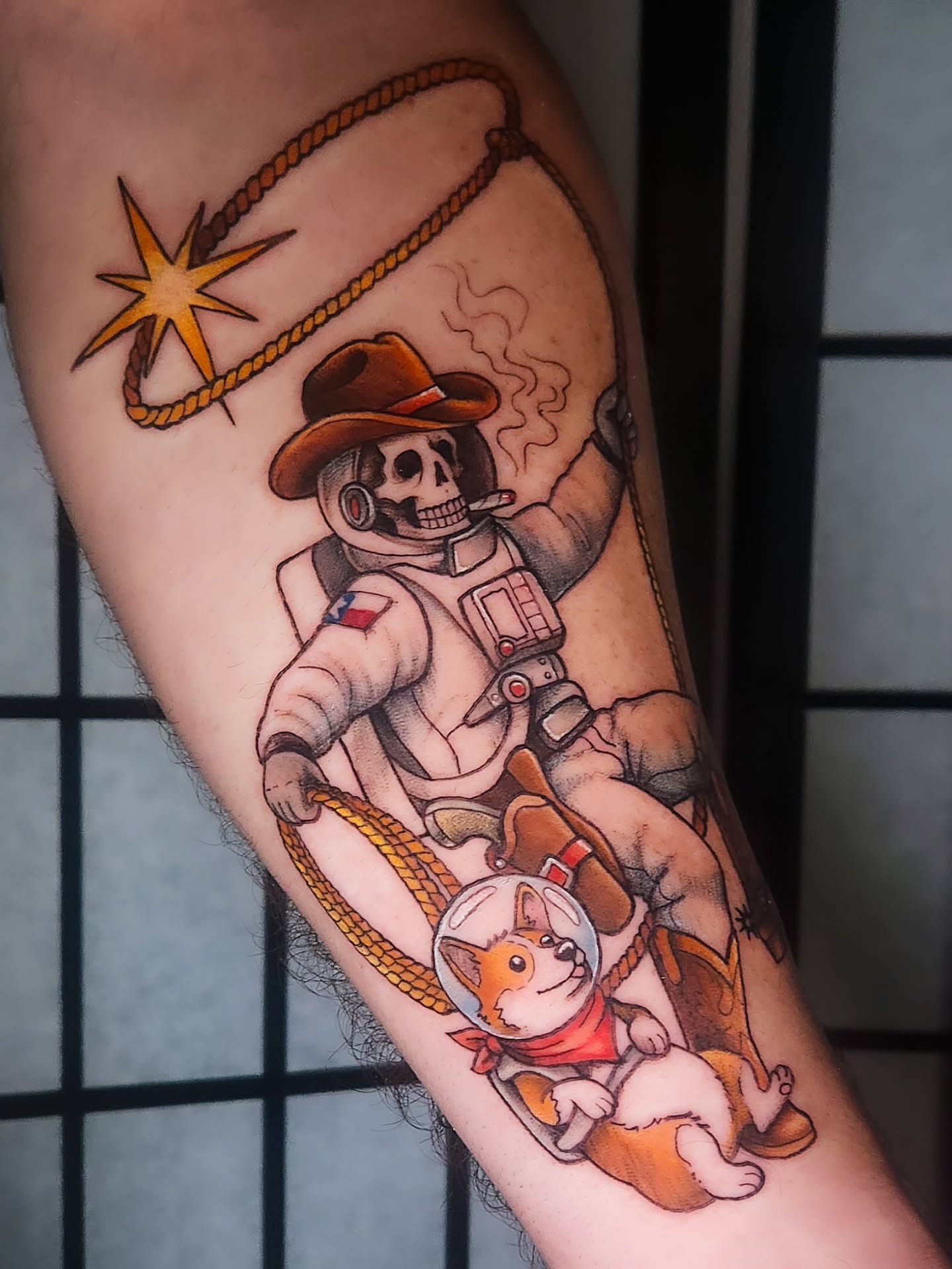 Astronaut and dog new school tattoo on the forearm by Amanda Boyd - Duh!