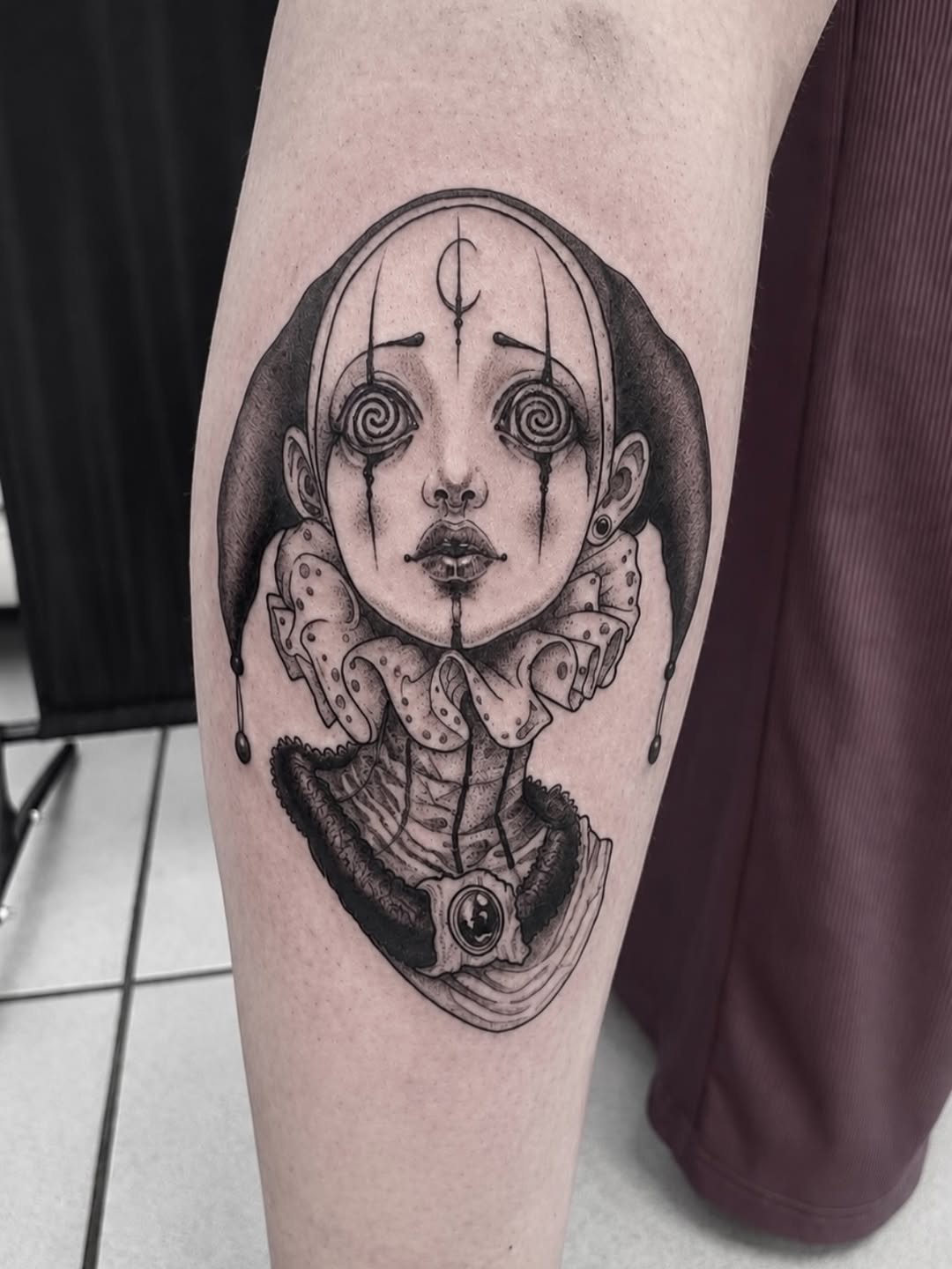 Tattoo by @amber_noir_tattoo — dark_realism, black_and_grey