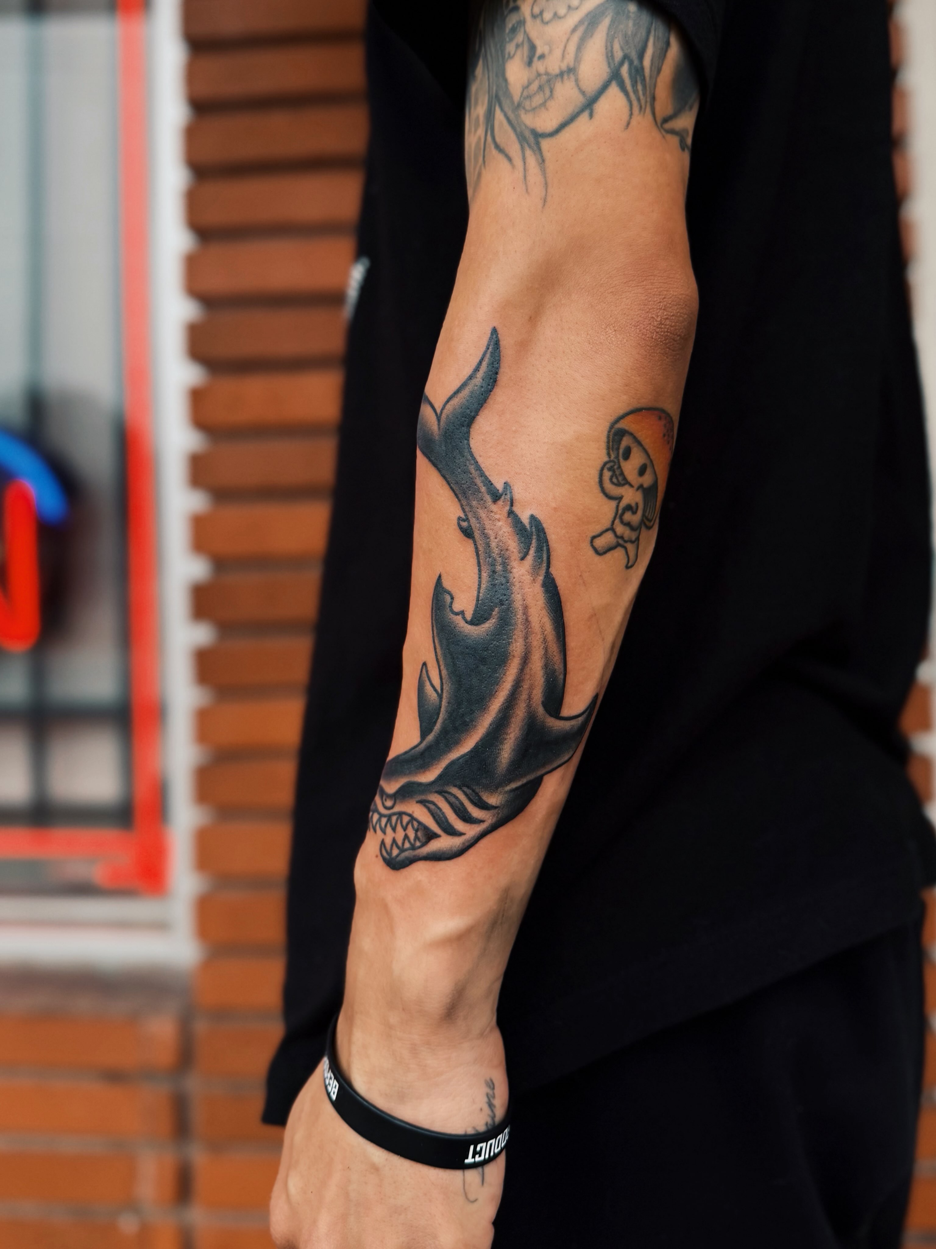 Shark black and grey tattoo on the forearm by @amandahowtattoo