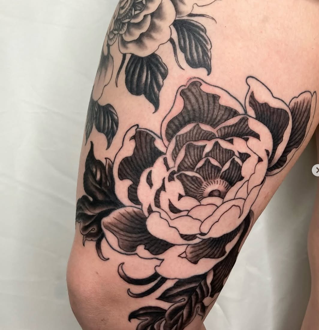 Peony black and grey tattoo on the thigh by Hunter McGinnis