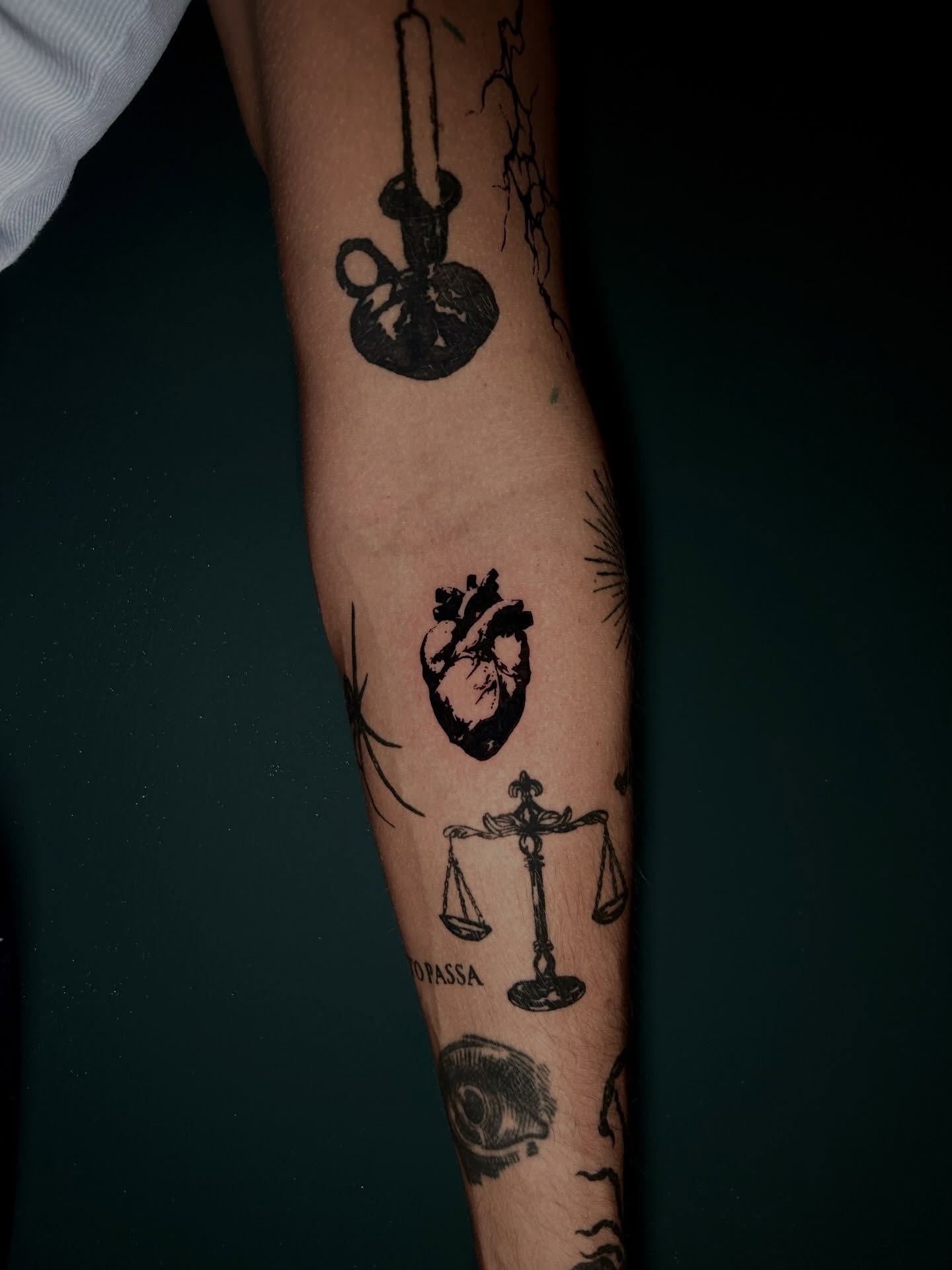 Heart and scales black and grey tattoo on the forearm by KB