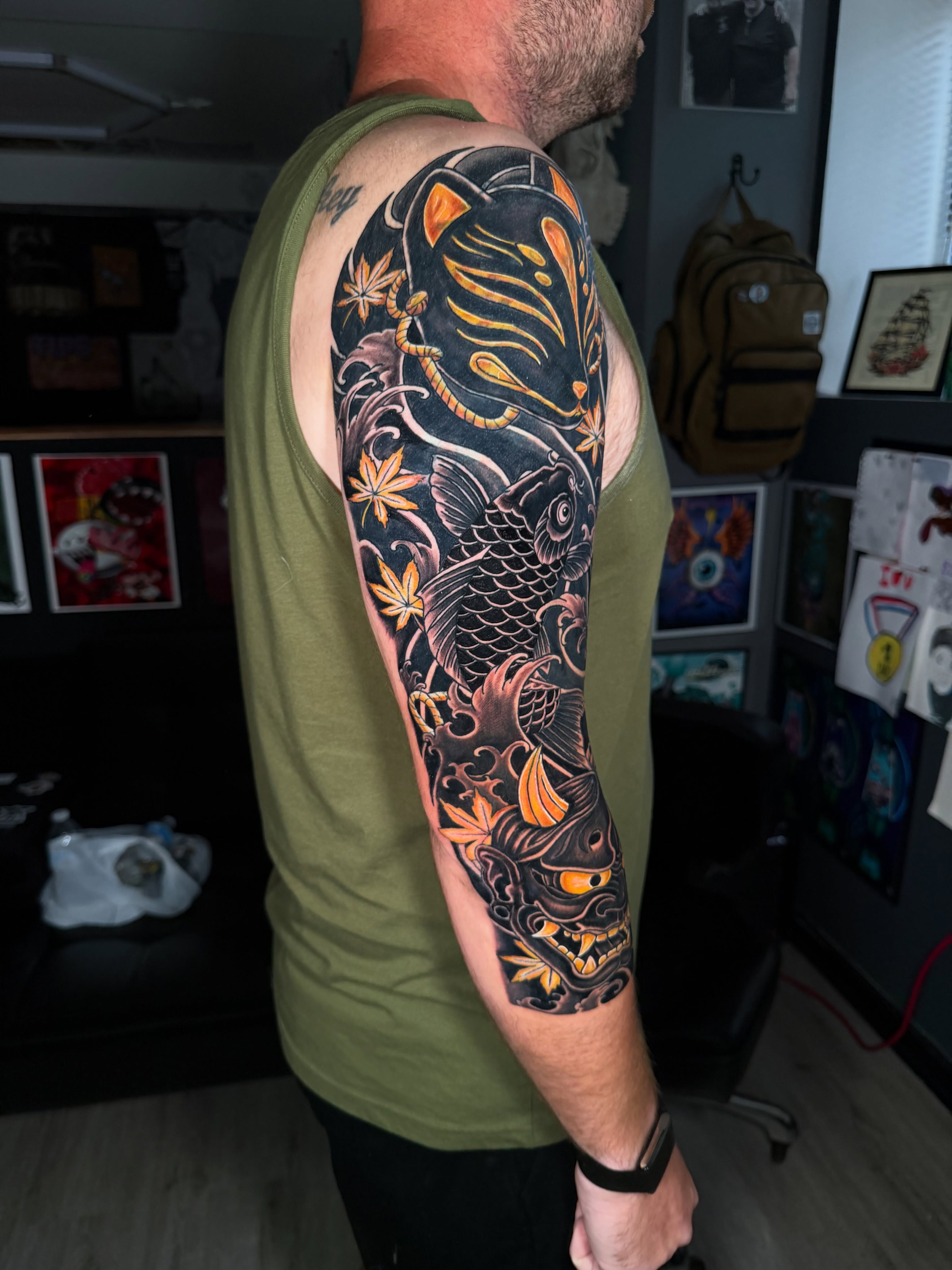 Koi fish japanese irezumi tattoo on the upper arm by Beau Zeis