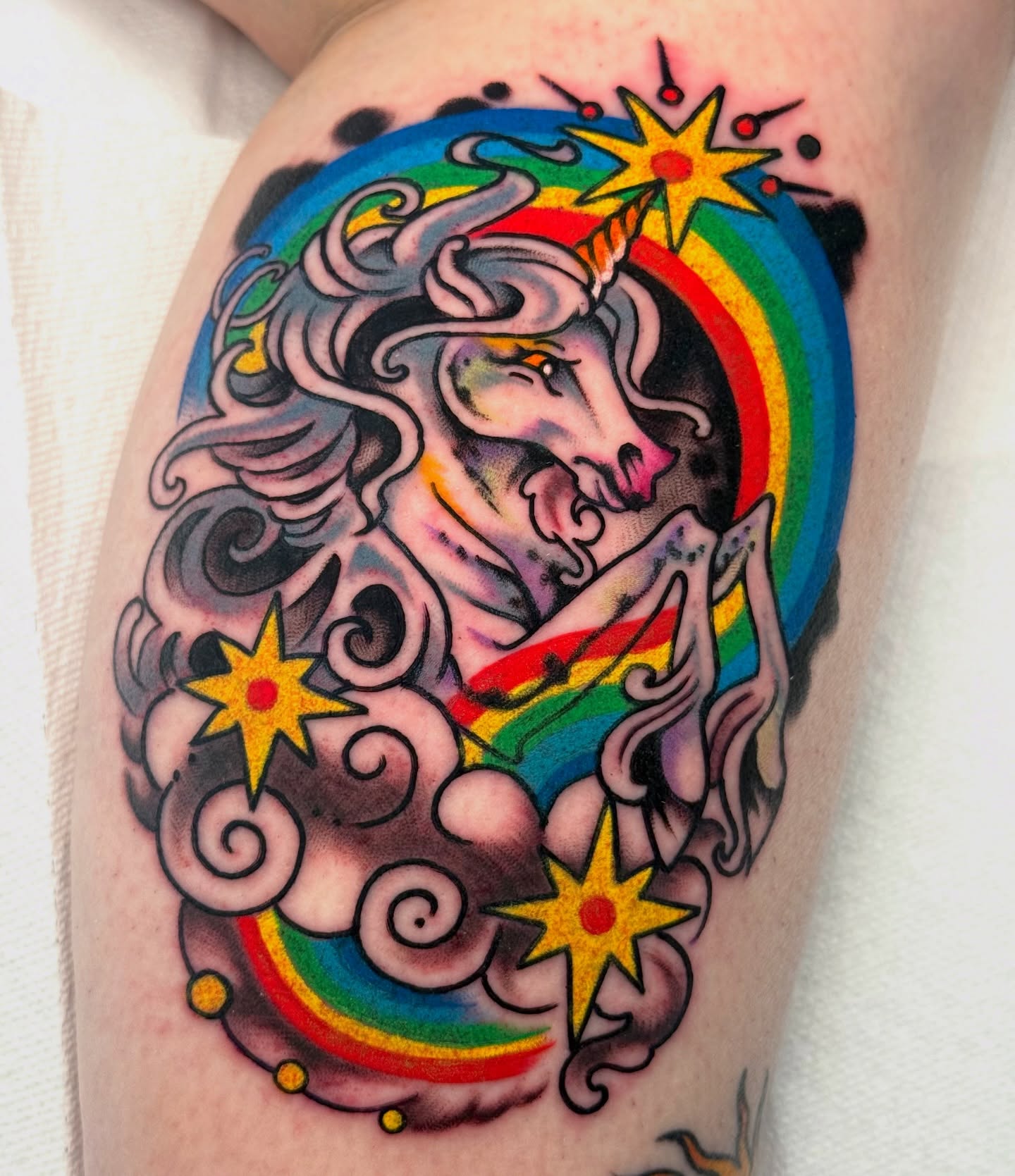 Unicorn new school tattoo on the thigh by sydtatz