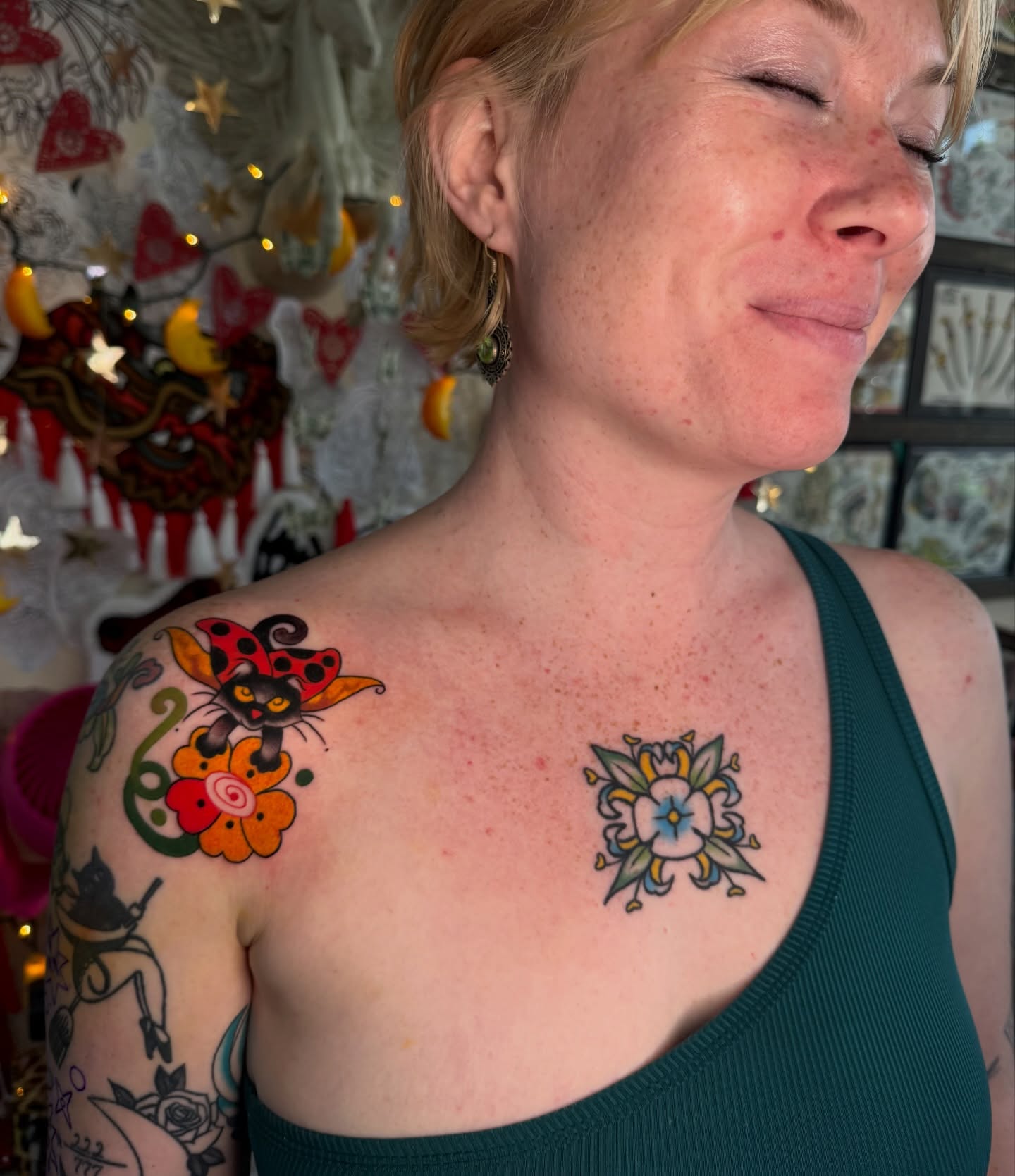 Cat and flower trash polka tattoo on the shoulder by sydtatz