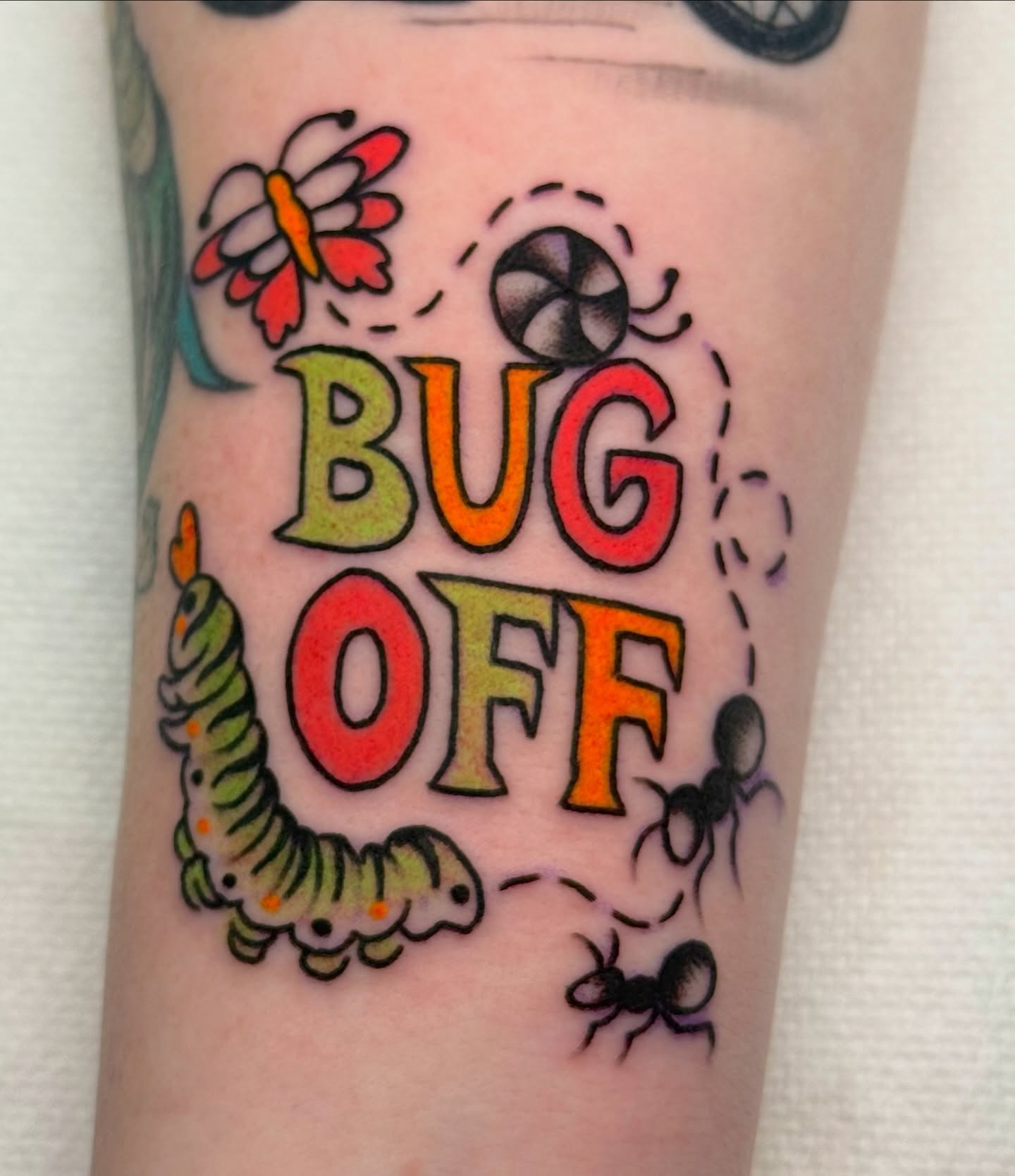 Bug off new school tattoo on the forearm by sydtatz