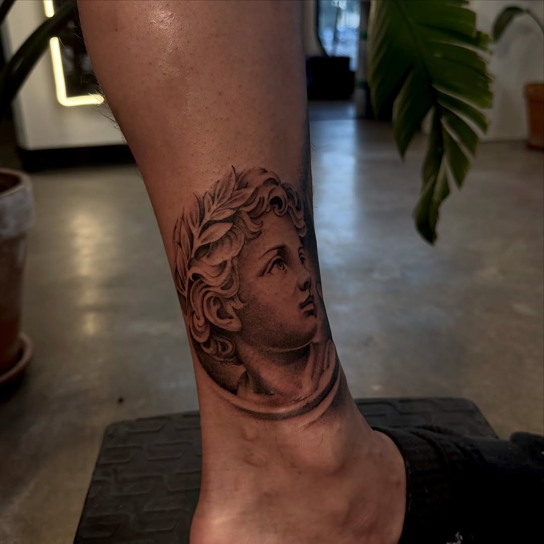 Tattoo by @joe.cruz_tattoos — realism, black_and_grey