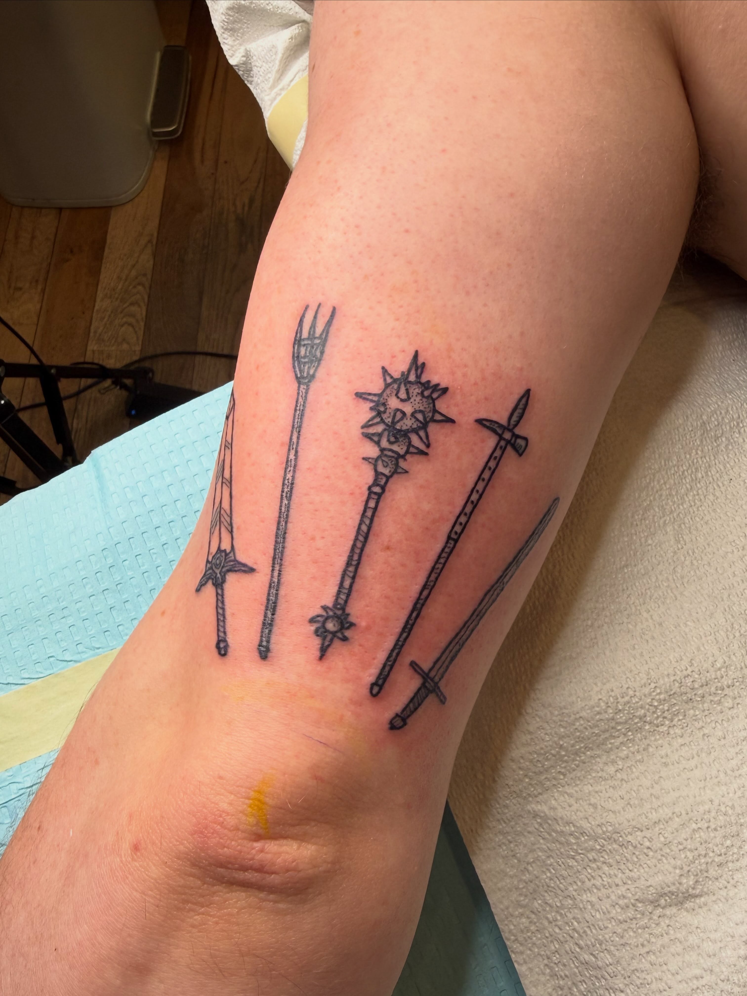 Warfare weapons black and grey tattoo on the forearm by Eric Guntor, Philadelphia, Pennsylvania