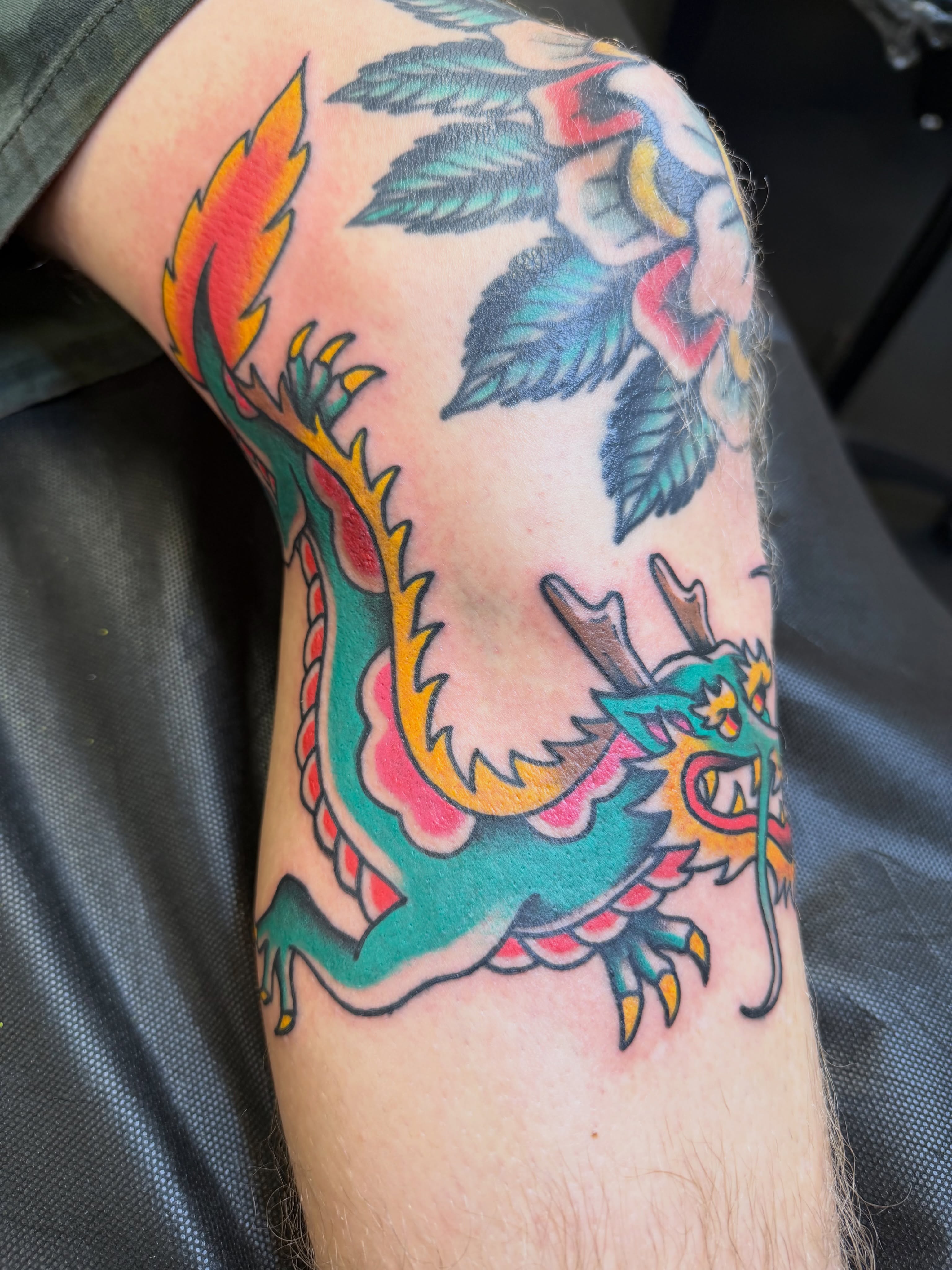 Dragon American traditional tattoo on the forearm by Nick Tumminello