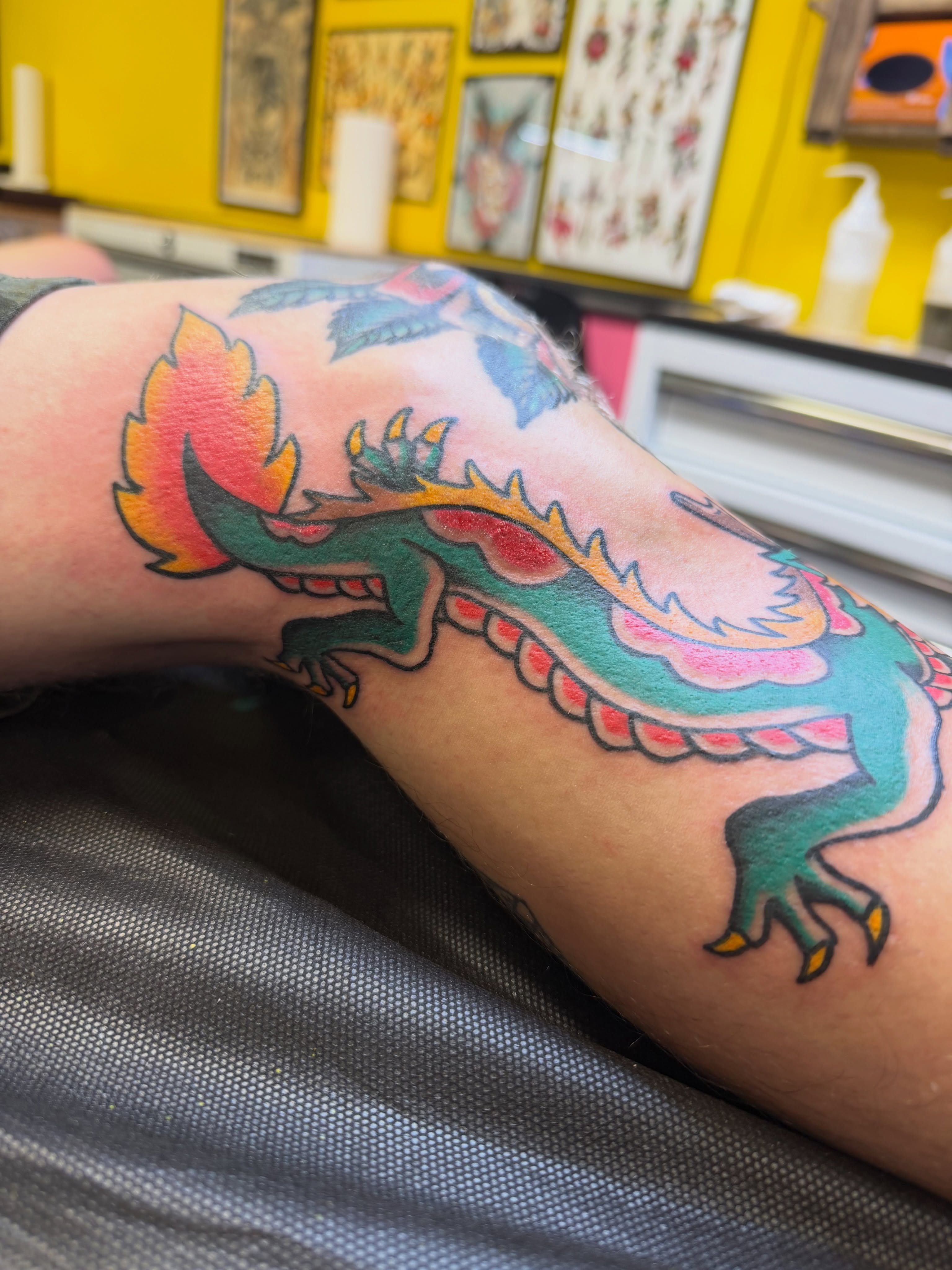 Dragon American traditional tattoo on the forearm by Nick Tumminello