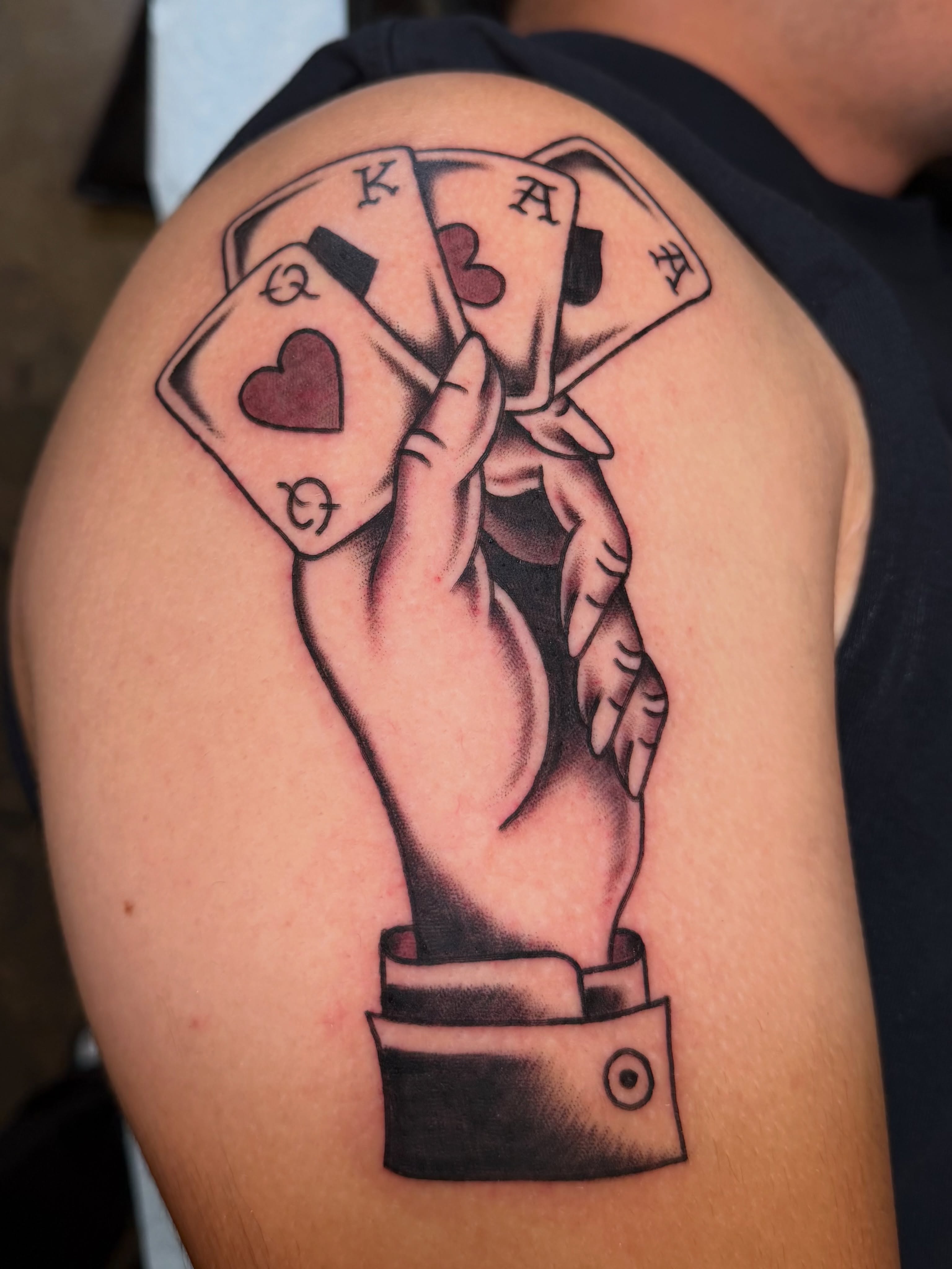 Playing cards American traditional tattoo on the shoulder by Tyler Brown, San Diego, California