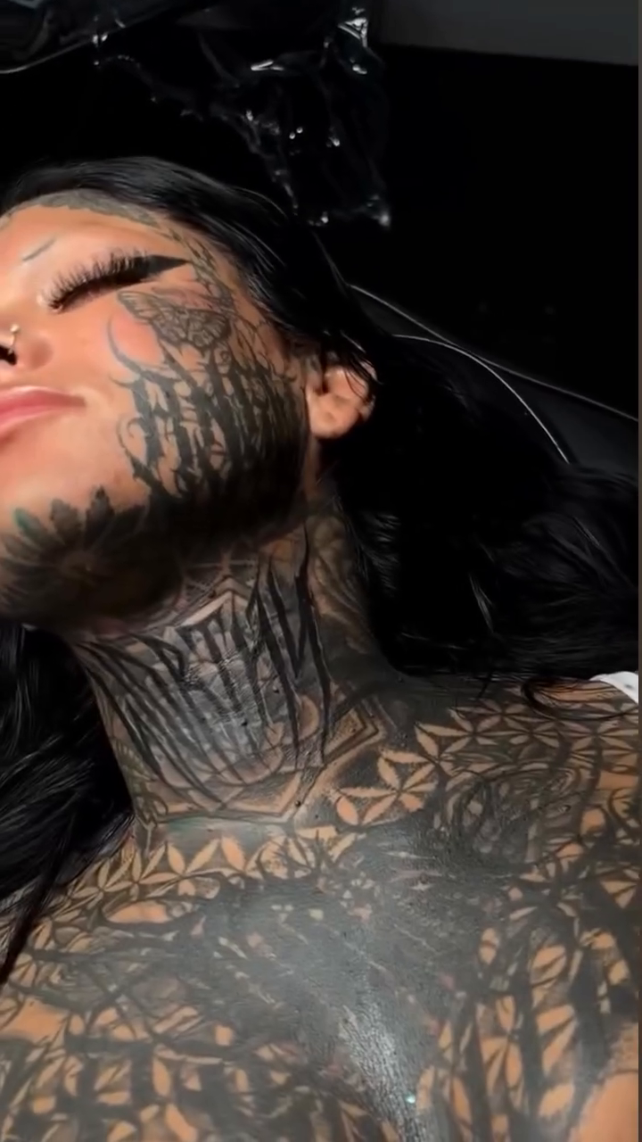 Geometric patterns on neck and chest blackwork tattoo by Turk