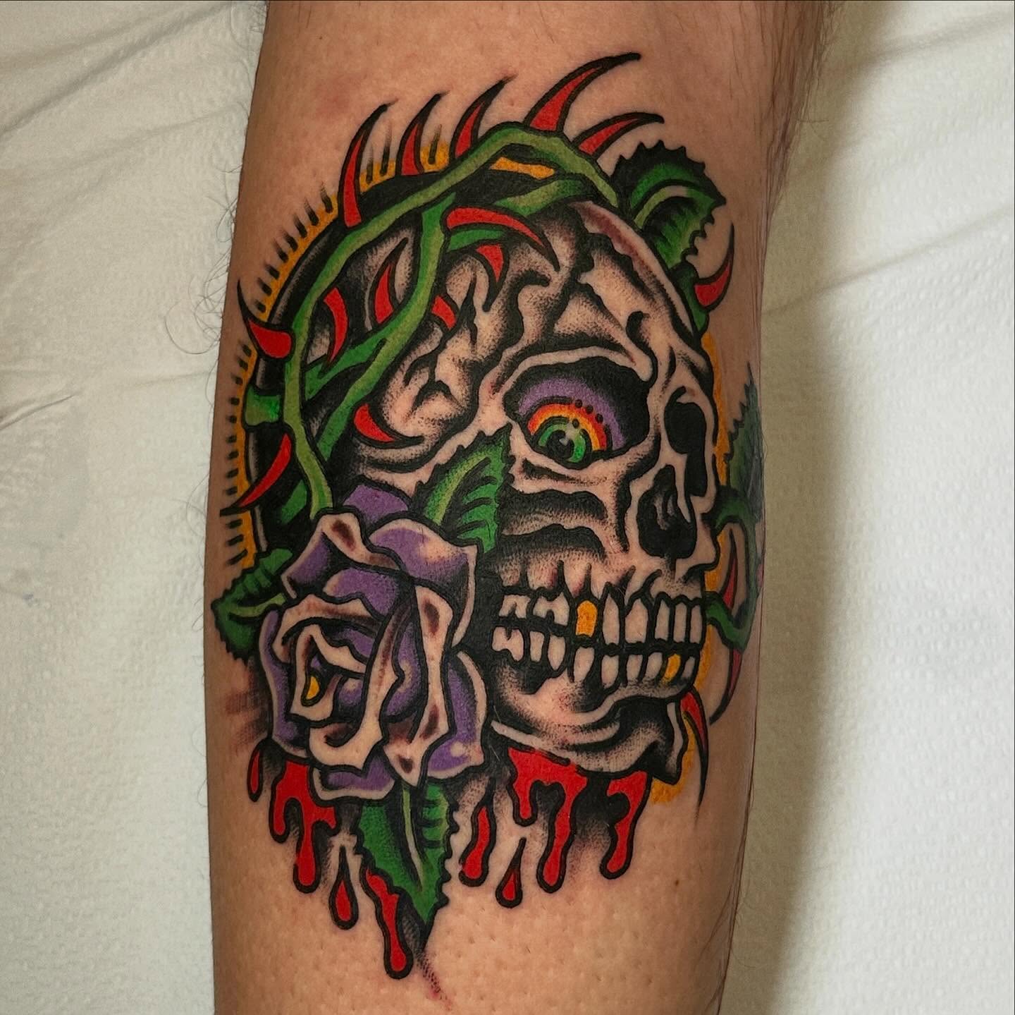 Skull and roses American traditional tattoo on the forearm by Jared Allen, Saint Petersburg, Florida