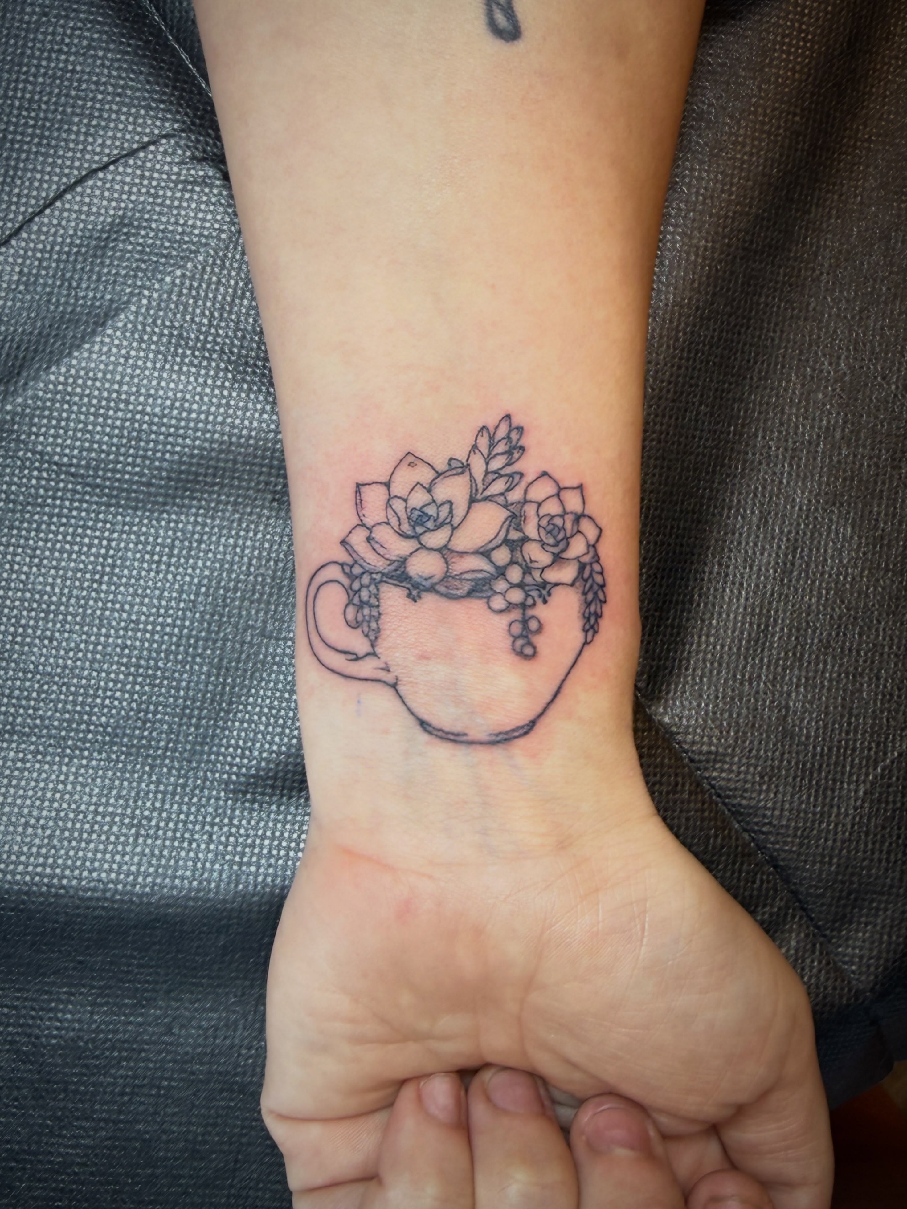 Cup with succulents black and grey tattoo on the forearm by Taytum Marsing, Salt Lake City, Utah