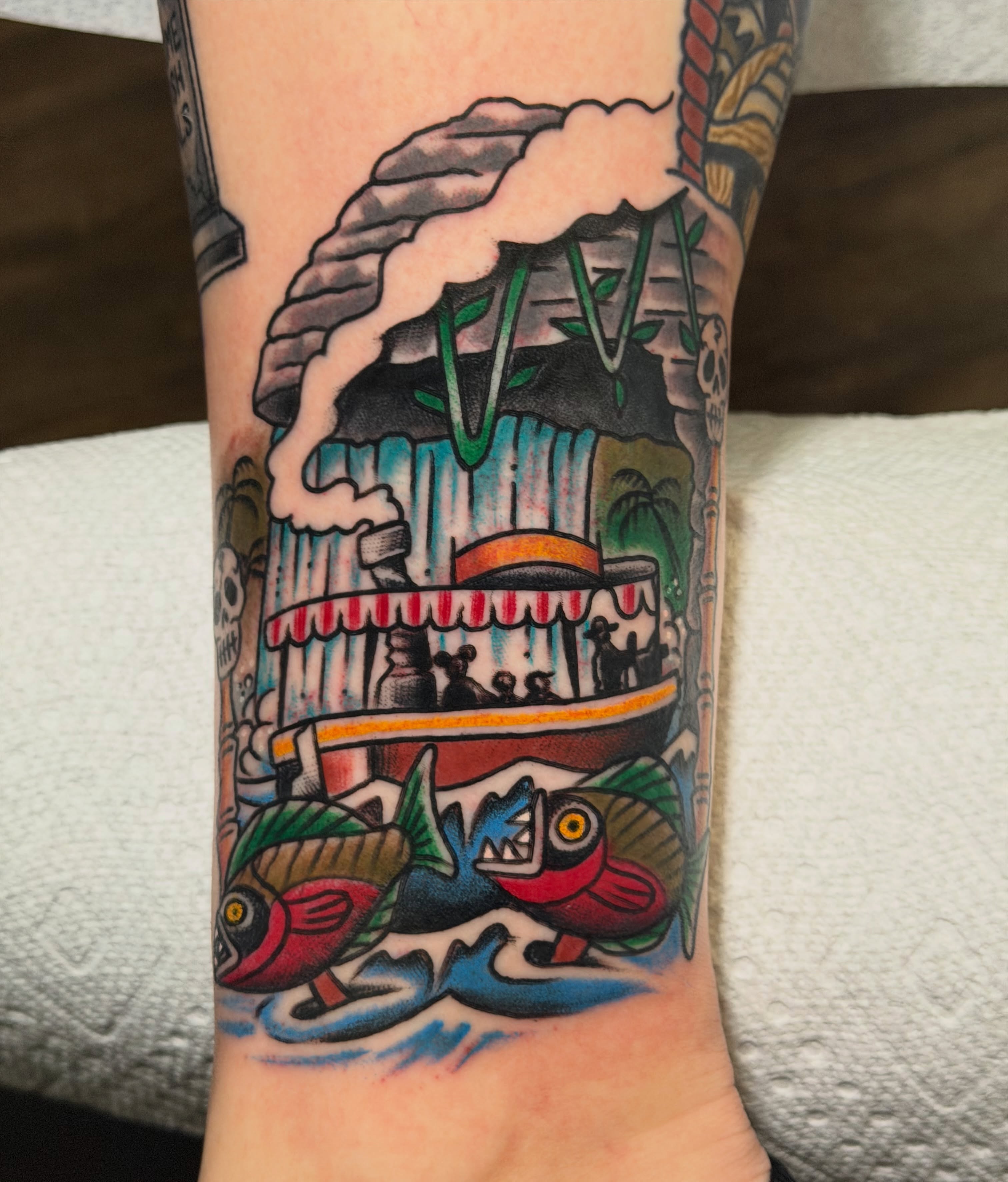 Waterfall and fish American traditional tattoo on the forearm by Brandon Bear