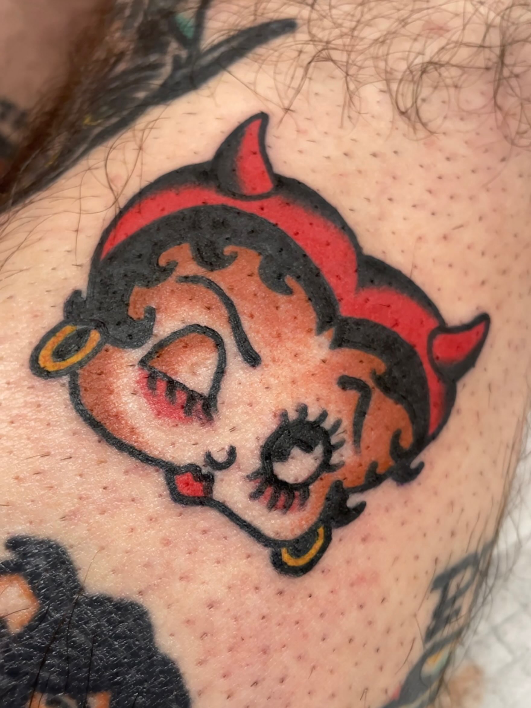 Betty boop devil American traditional tattoo on the shoulder by dave rash