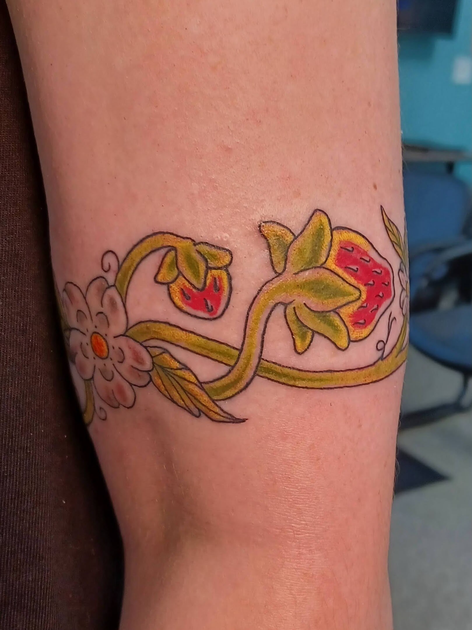 Floral vine new school tattoo on the forearm by Abi