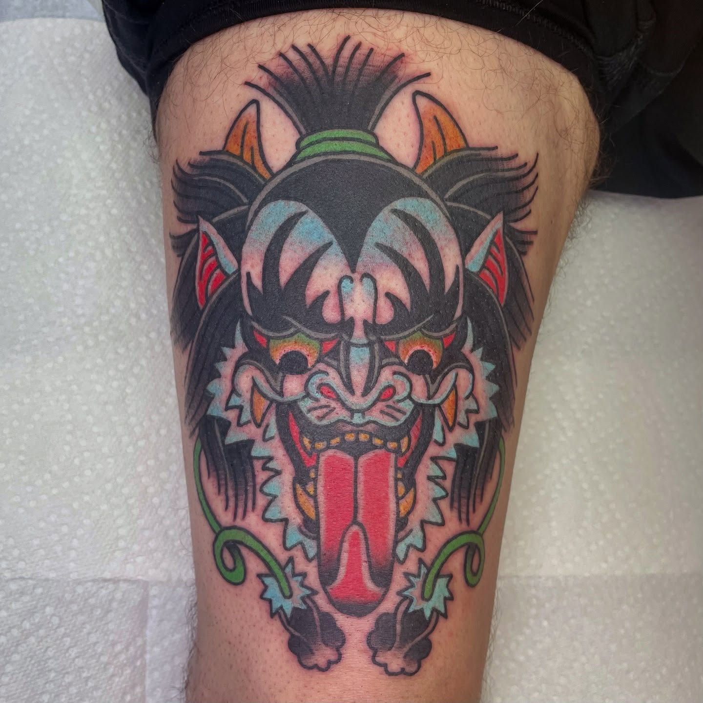 Demon mask japanese irezumi tattoo on the thigh by Robert Morrow