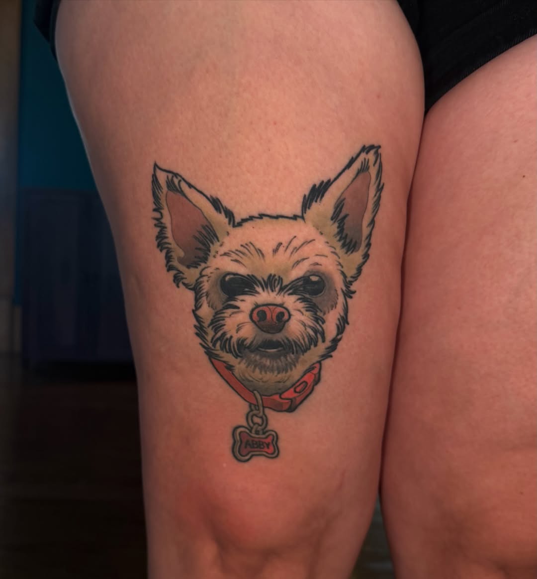 Dog realism tattoo on the thigh by Nathan Thomas