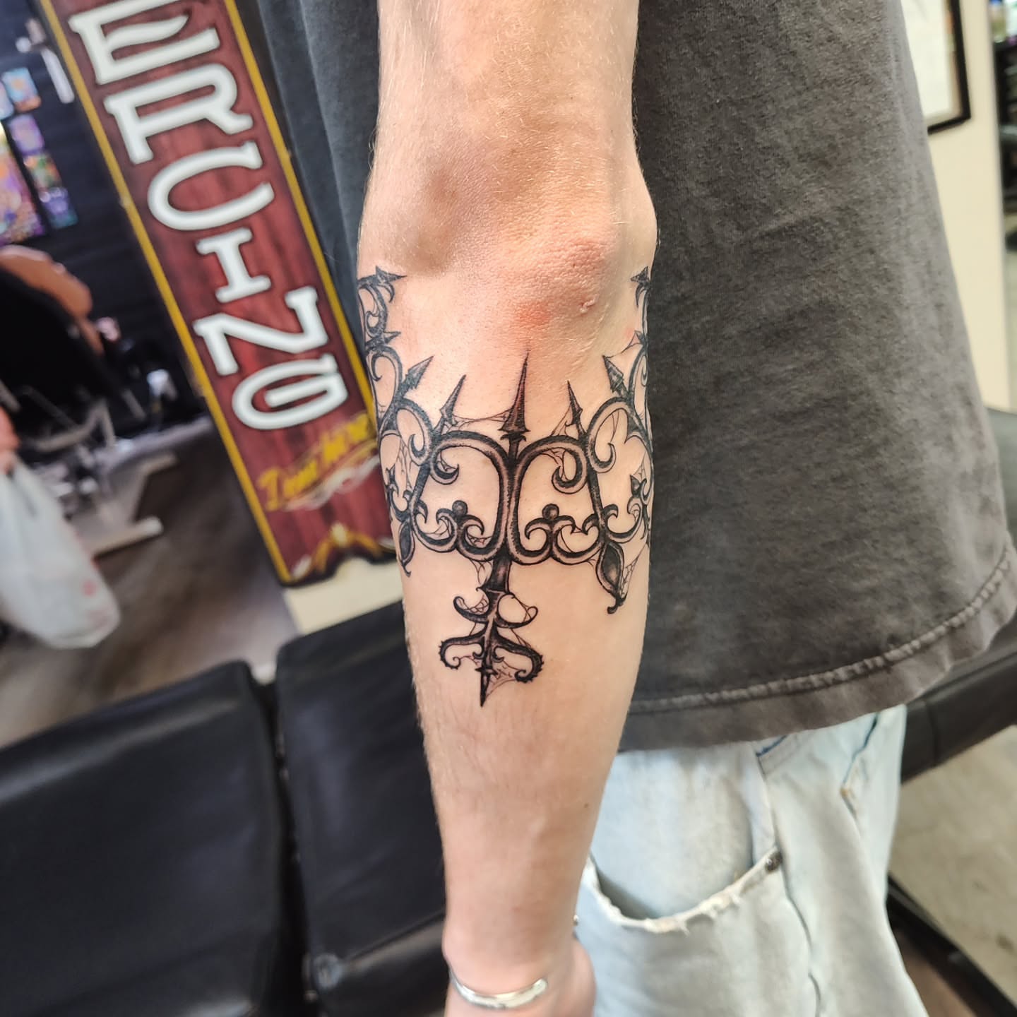 Ornamental crown ornamental tattoo on the forearm by Mercury