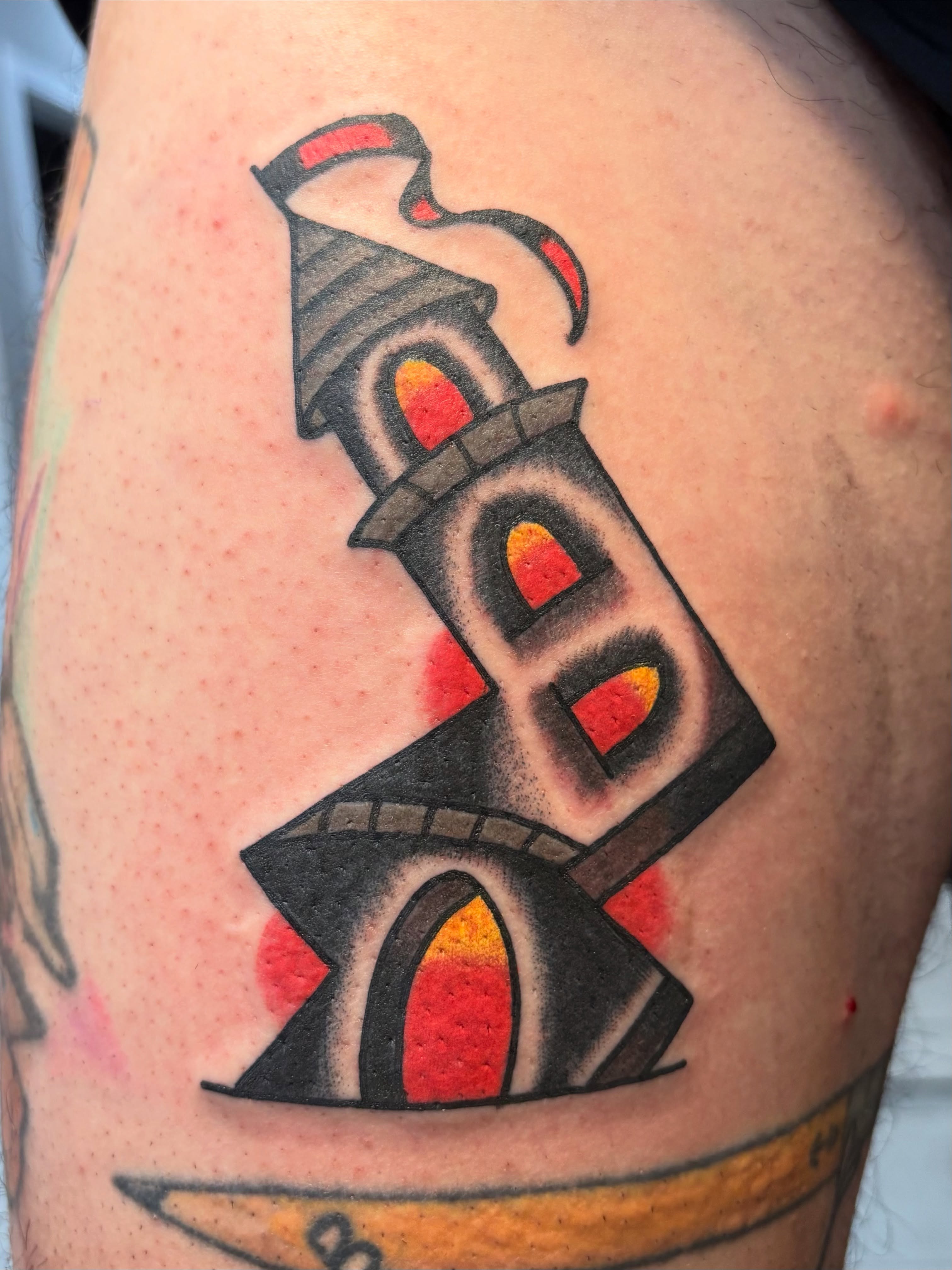 Lighthouse American traditional tattoo on the shoulder by Jake Herbert, Knoxville, Tennessee